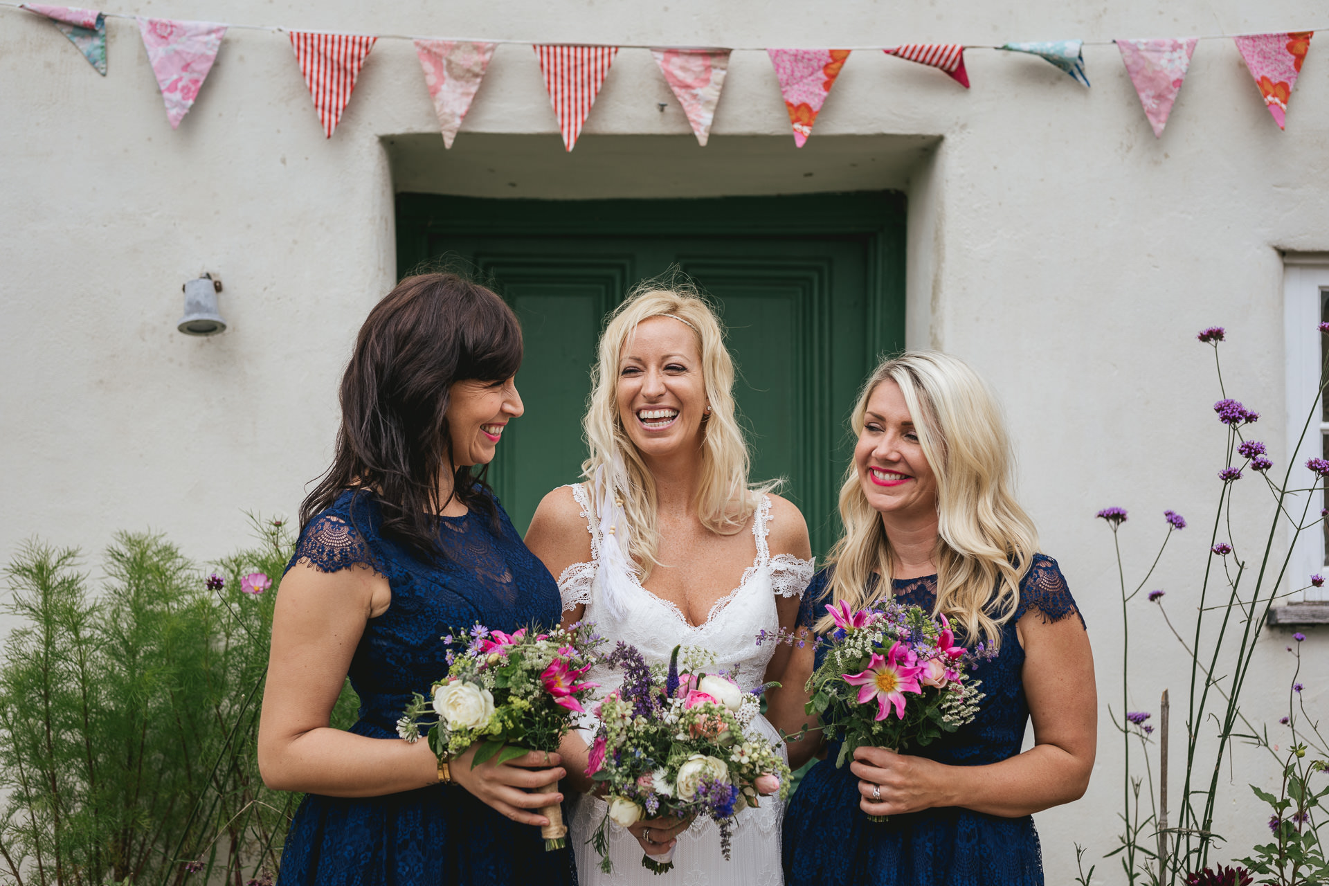 Bride and bridesmaids laughing together