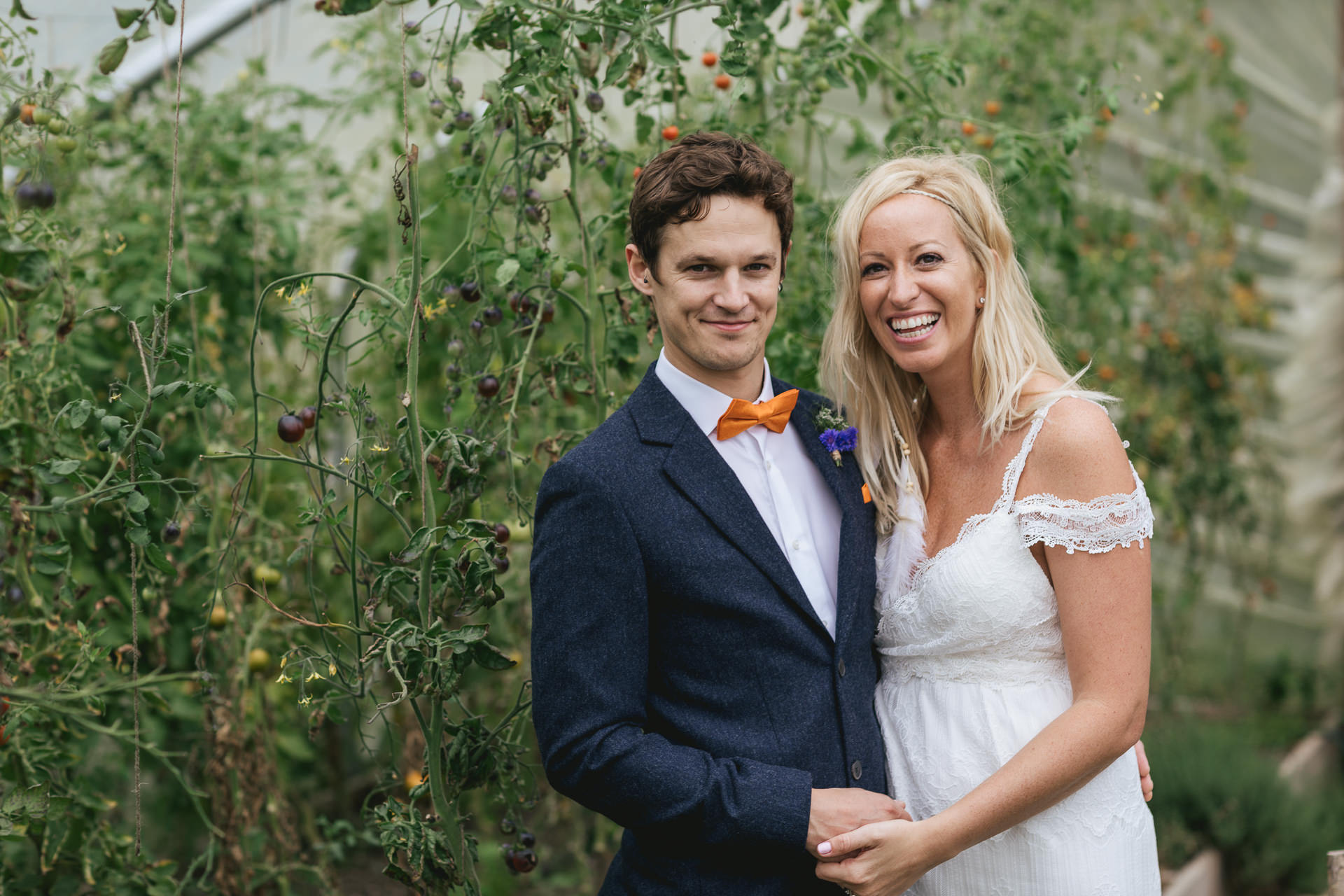 Bride and groom in a polytunnel
