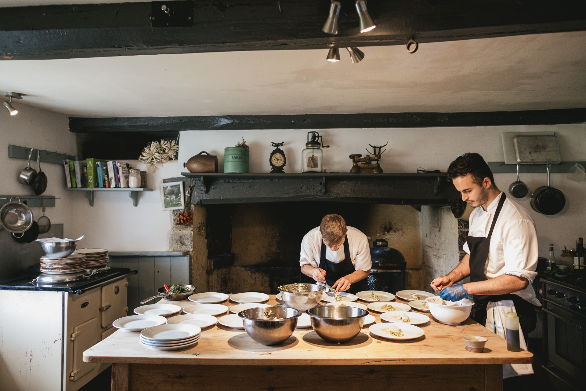 River Cottage chefs plating up food in the farmhouse