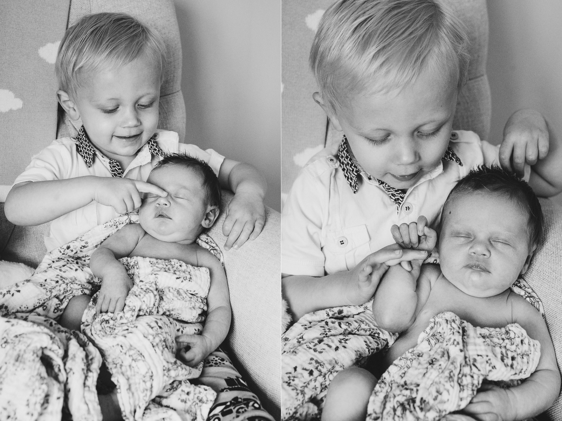 A young boy carefully cuddling his newborn sister
