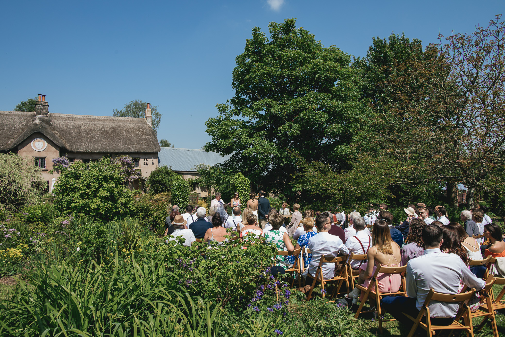 Wedding ceremony in the walled garden at Hayne