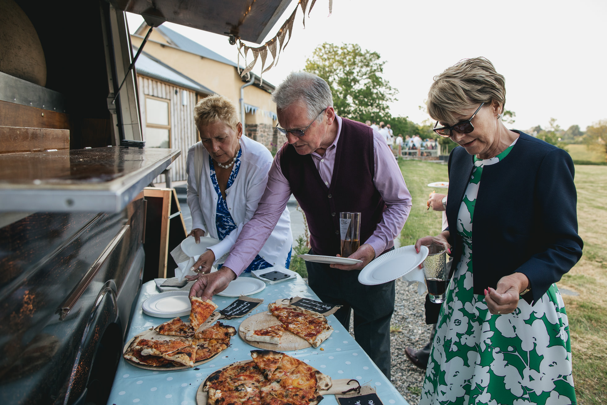 Wedding guests with stone fired pizza