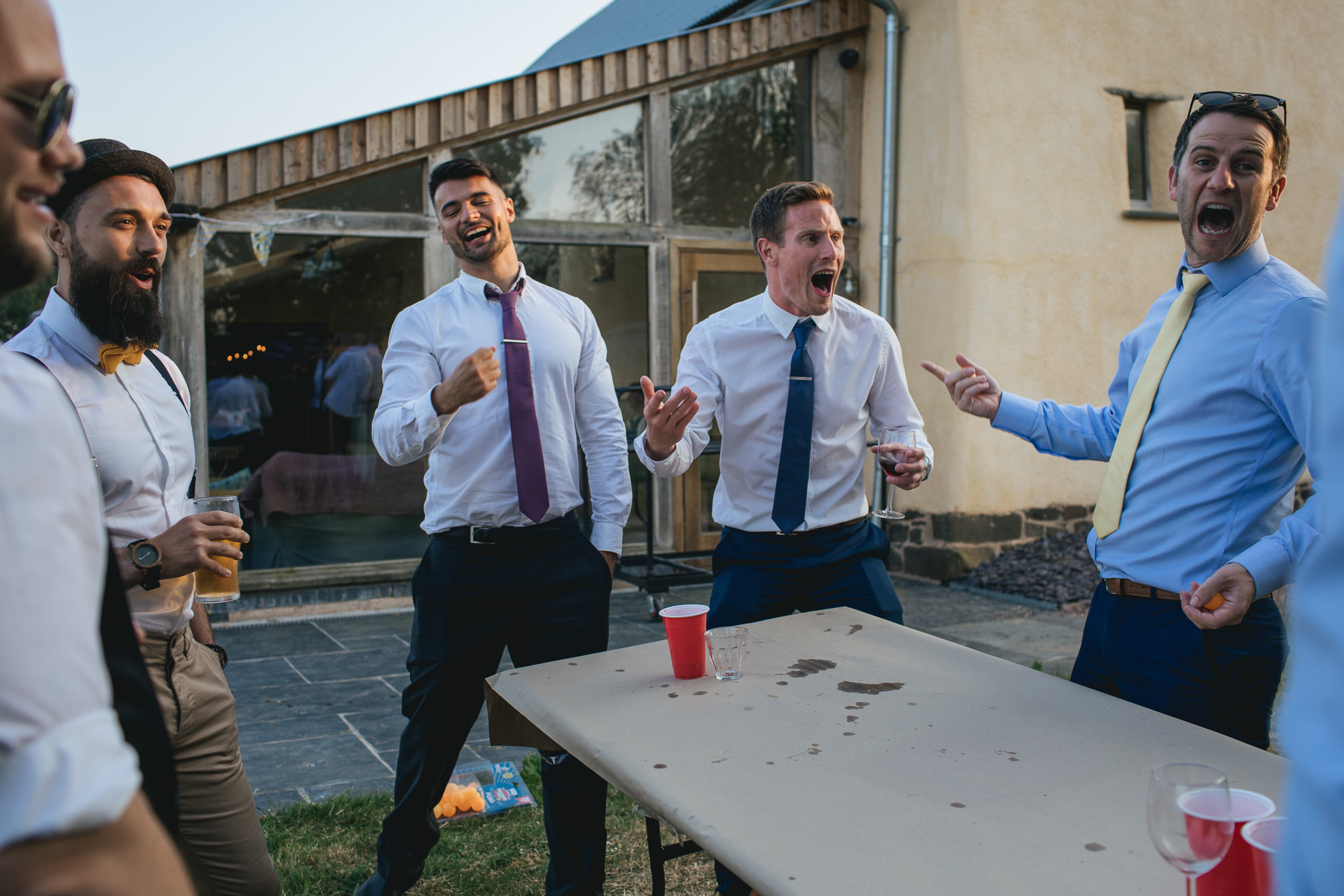 Wedding guests playing beer pong