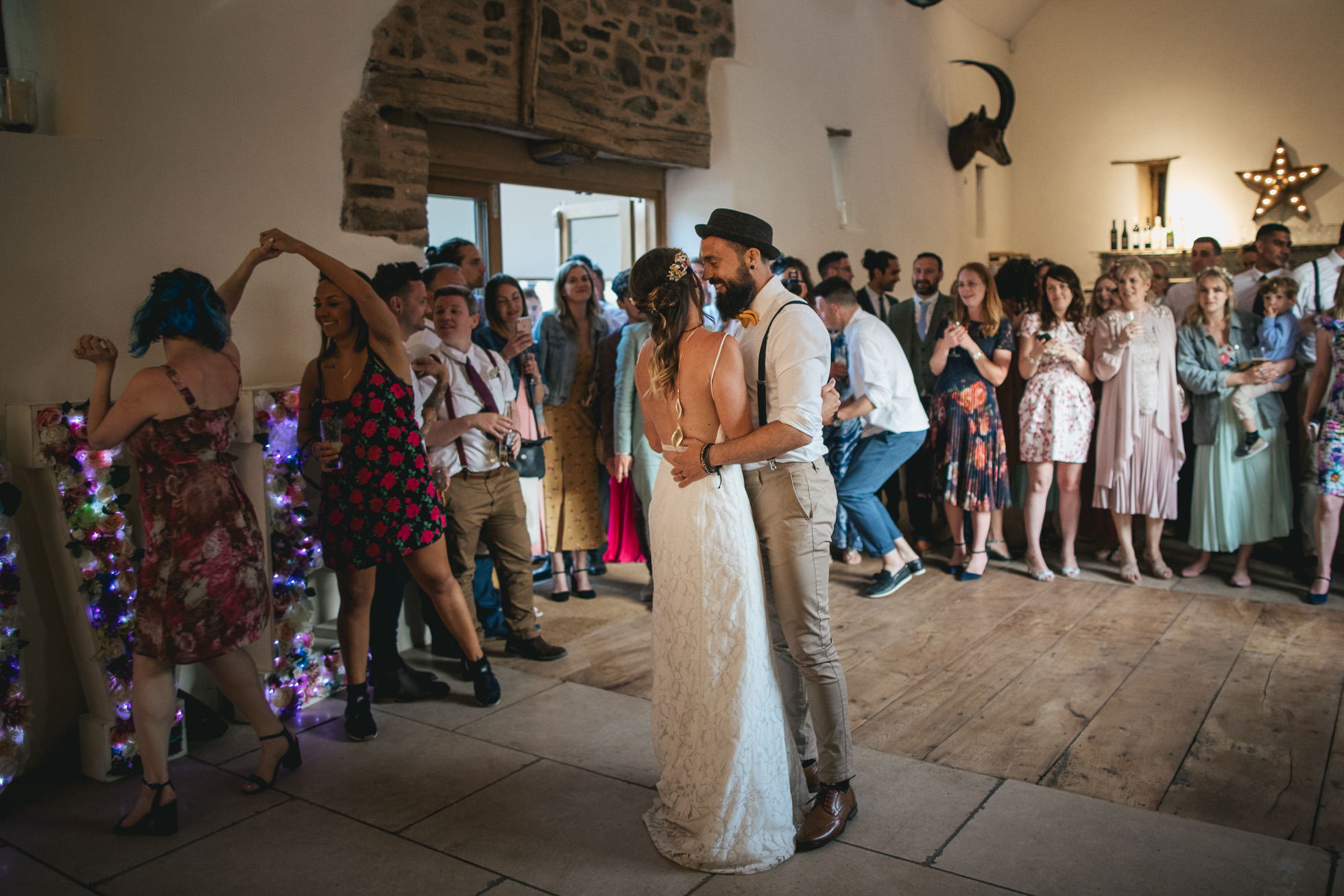 Bride and groom first dance in threshing barn