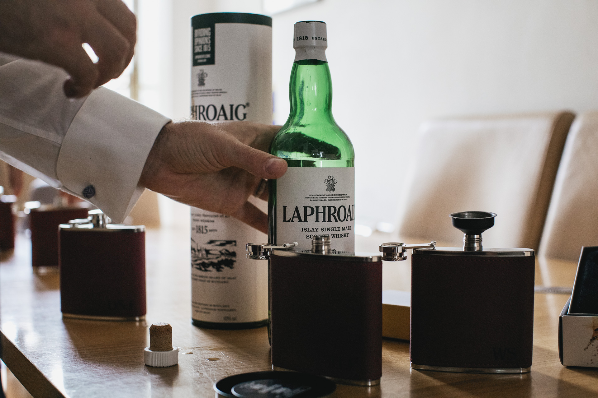 Hip flasks with bottle of whisky