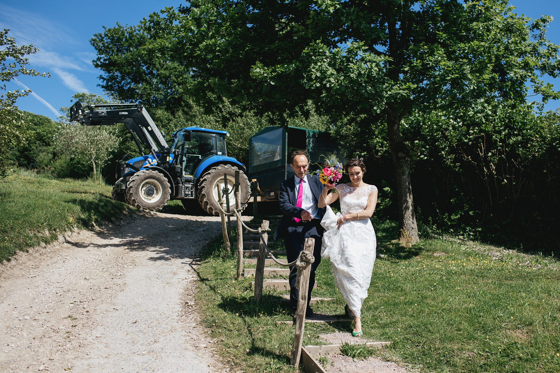 Bride and father arriving from tractor