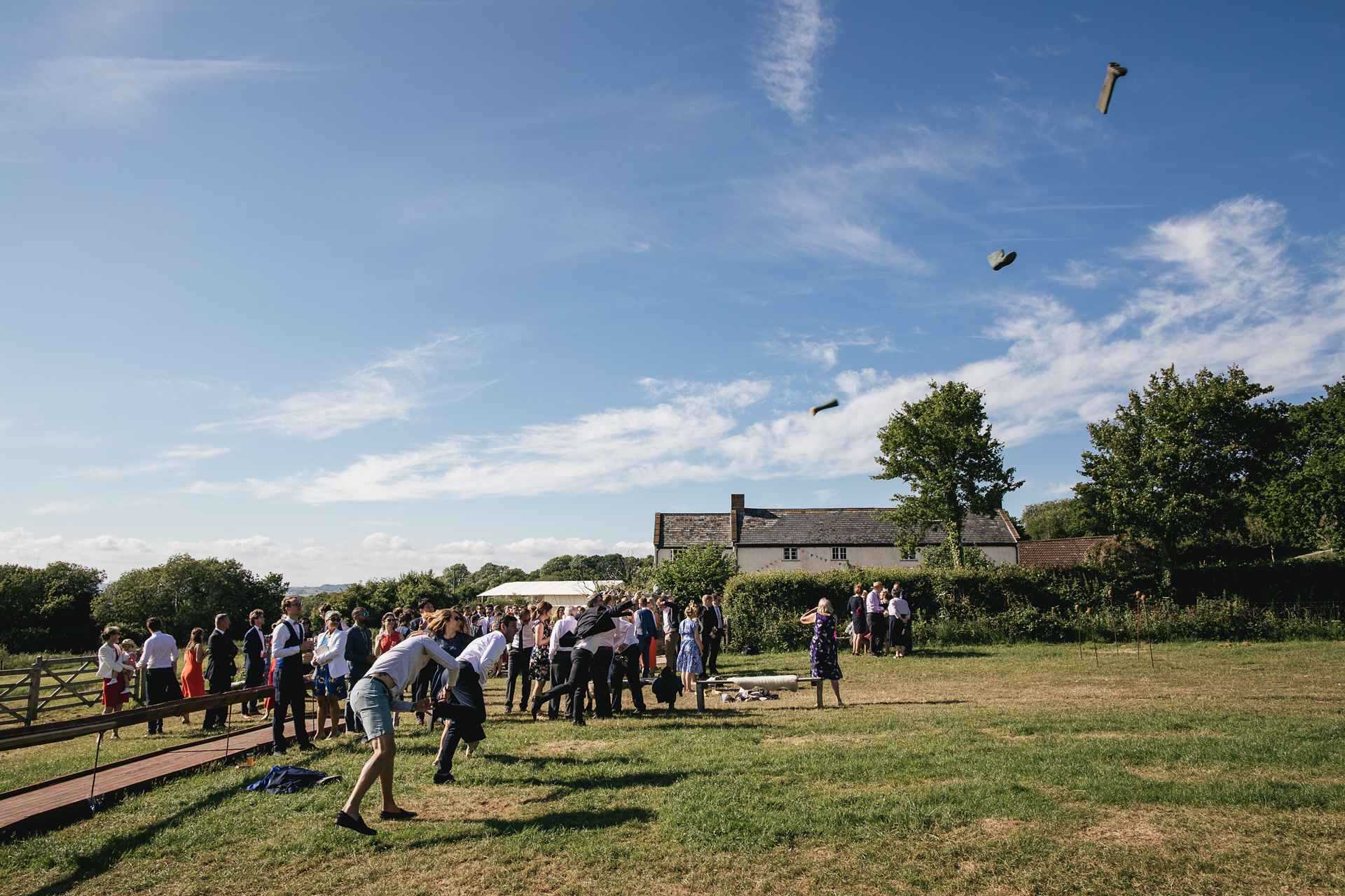 Guests throwing wellies at River Cottage wedding