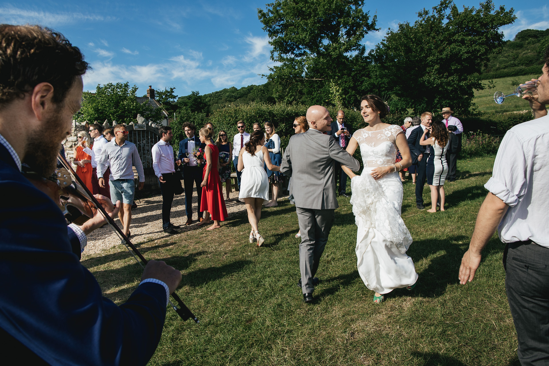 Bride dancing in a field 