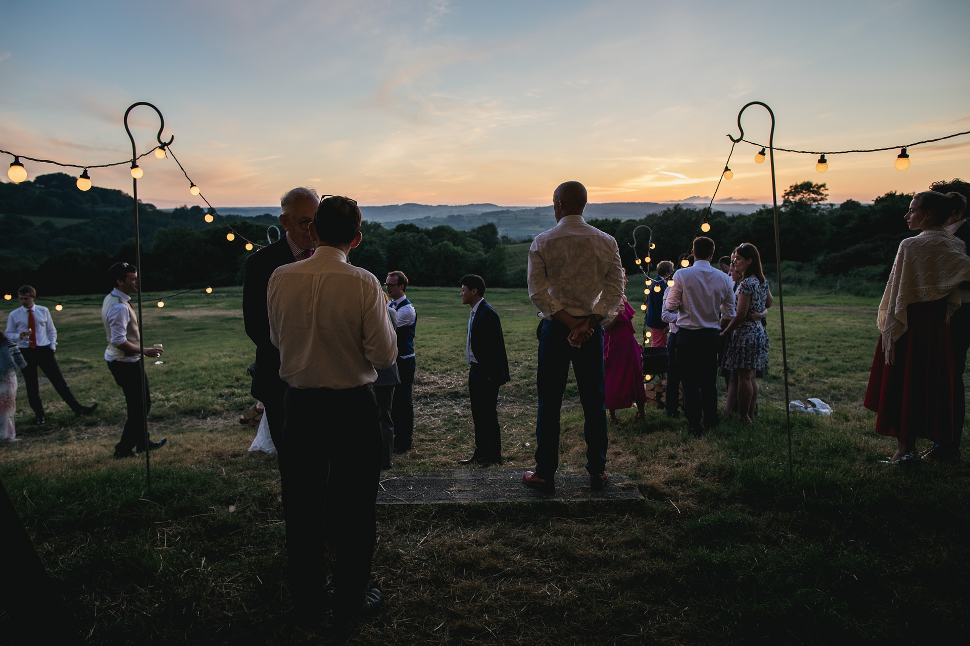 Wedding guests watching the sunset