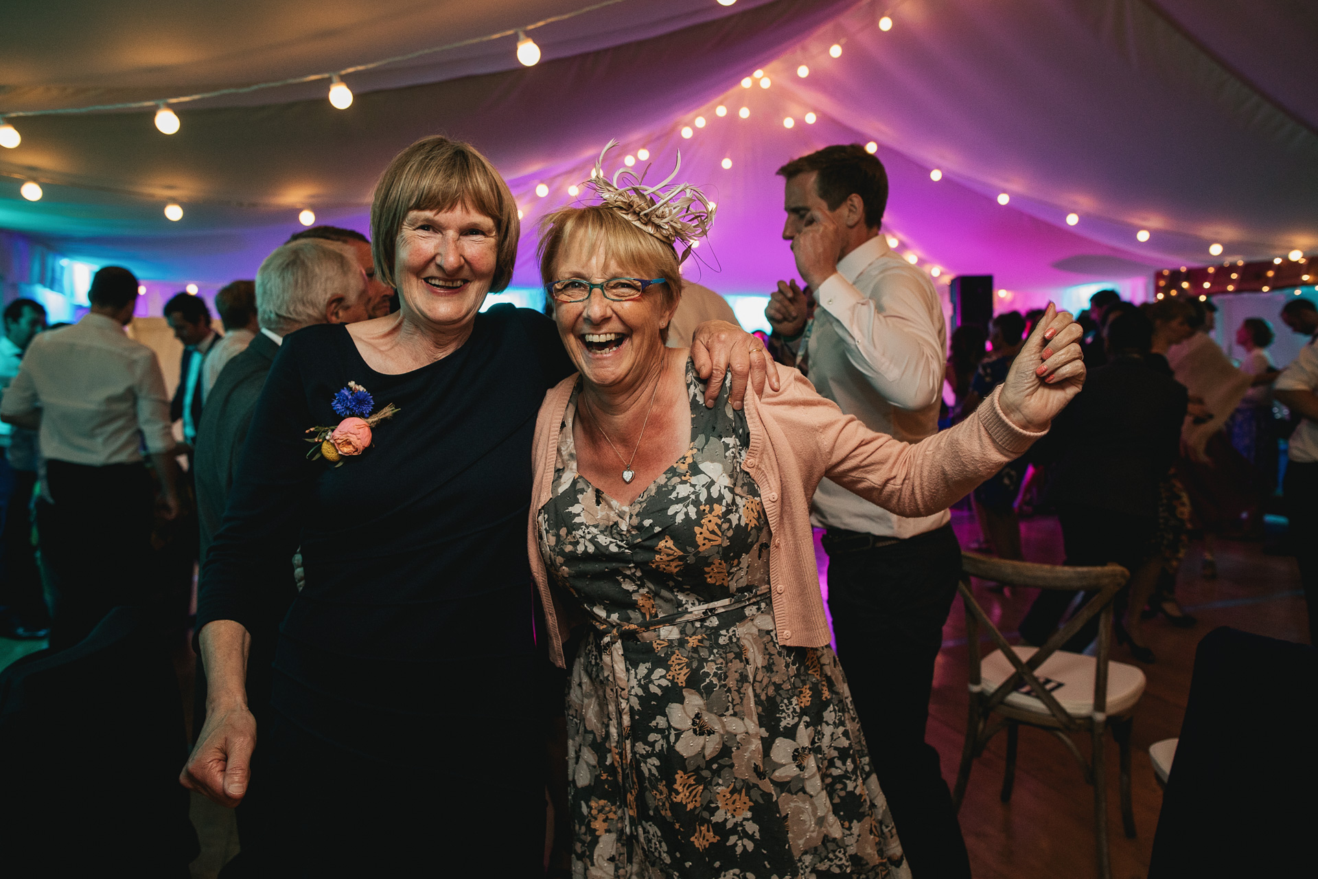 Two women smiling on the dance floor 