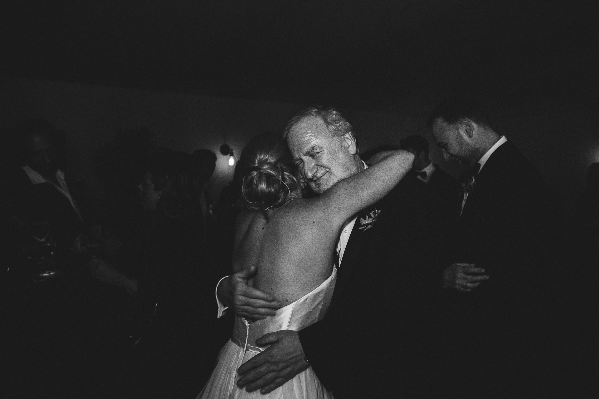 Father of groom dancing with bride