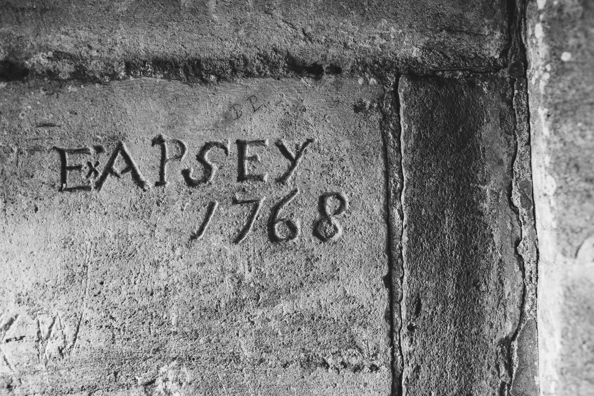 Carved name in church porch with date 1768