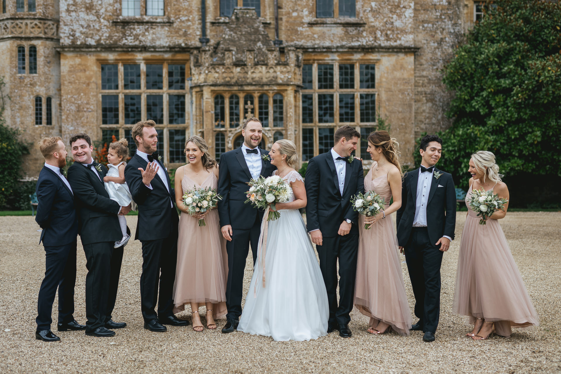 Group shot of bridal party outside Brympton House