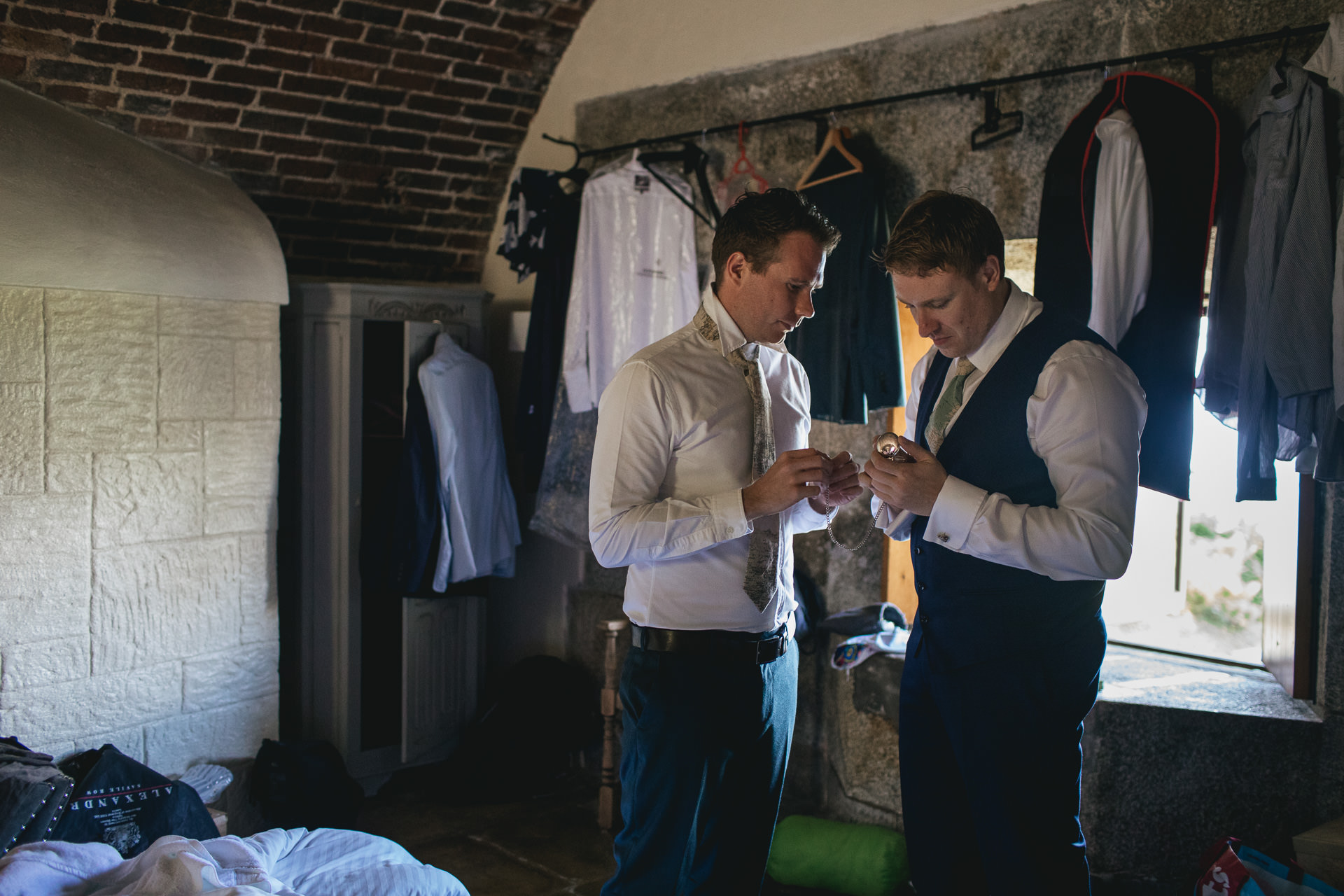 Two men getting dressed