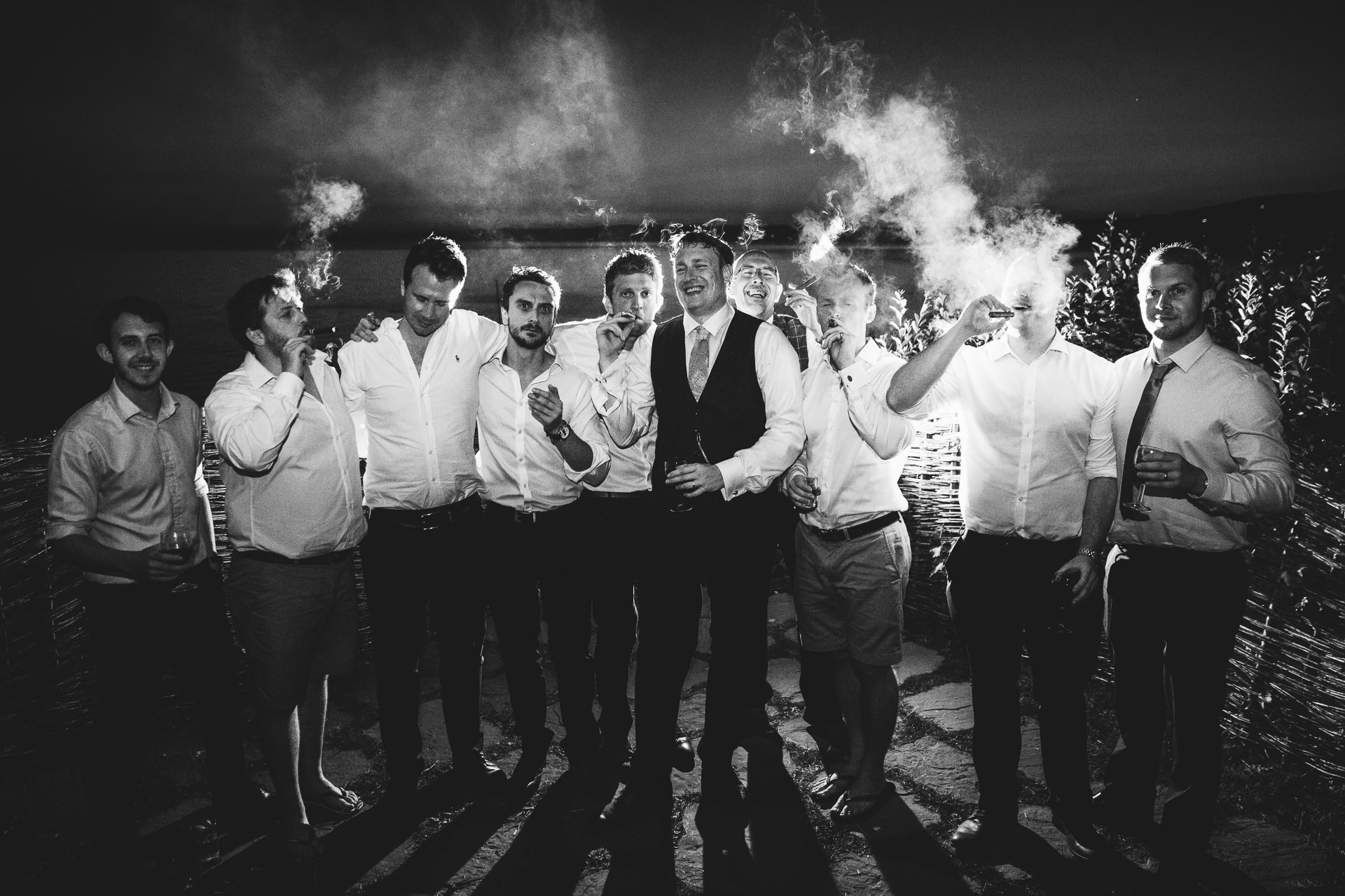 Groom and friends with cigars
