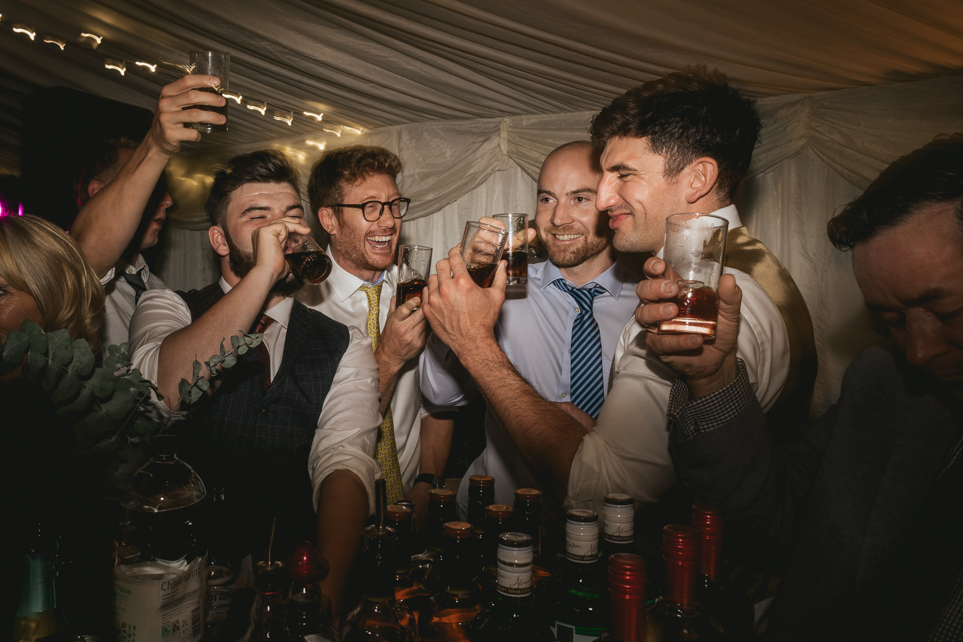 Group of men drinking shots