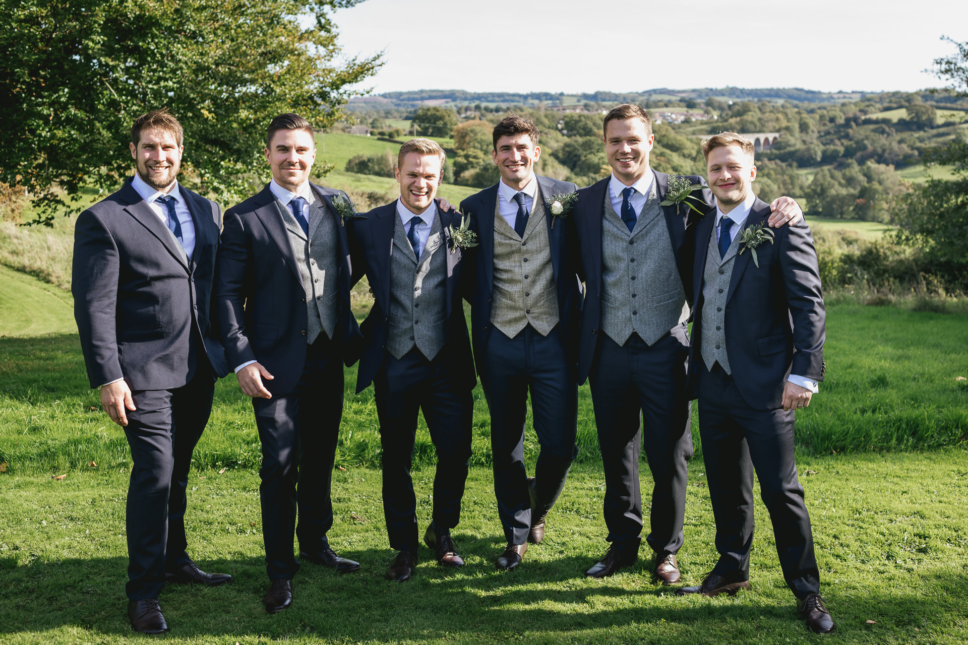 Groom and groomsmen group photo with Pensford Viaduct behind