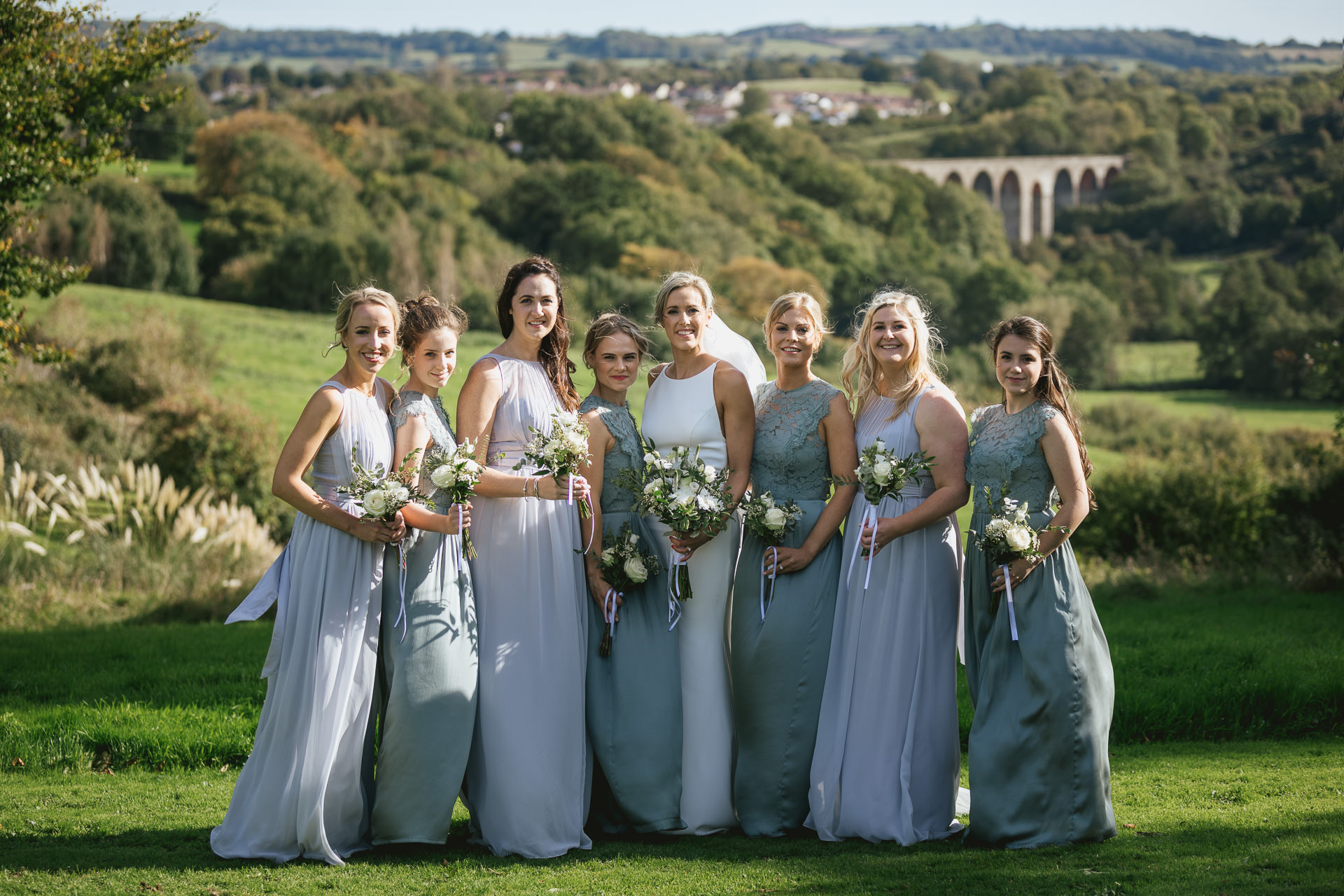 Bride and bridesmaids group photo with Pensford Viaduct behind