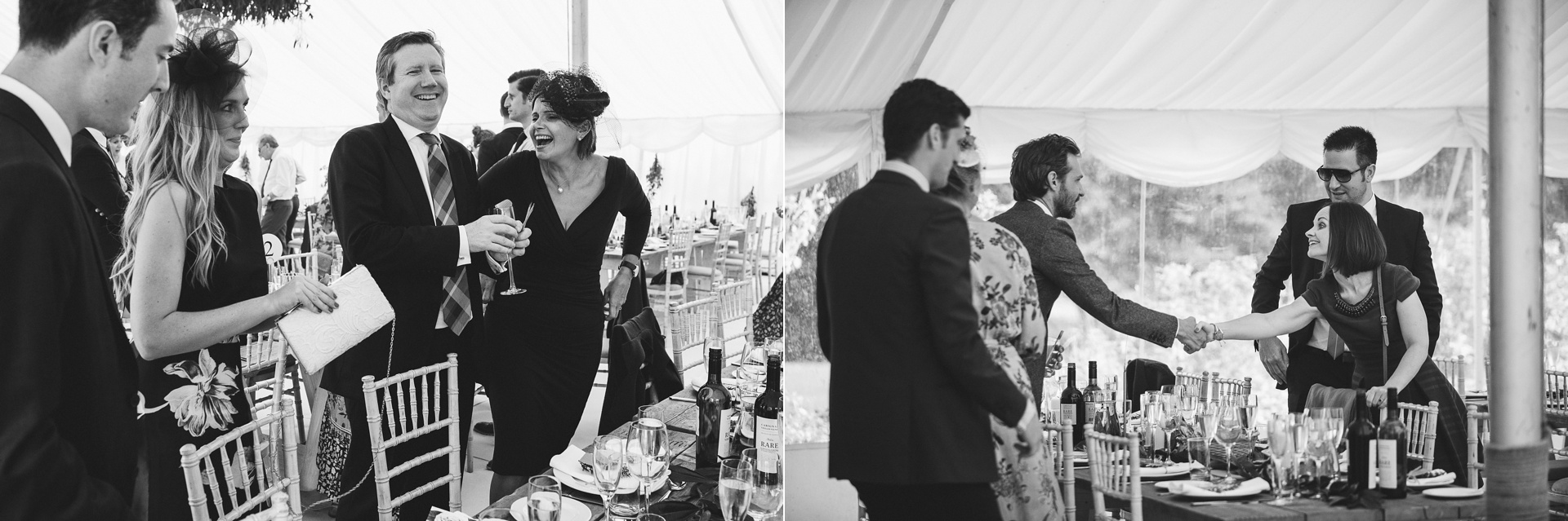 Guests laughing inside a marquee