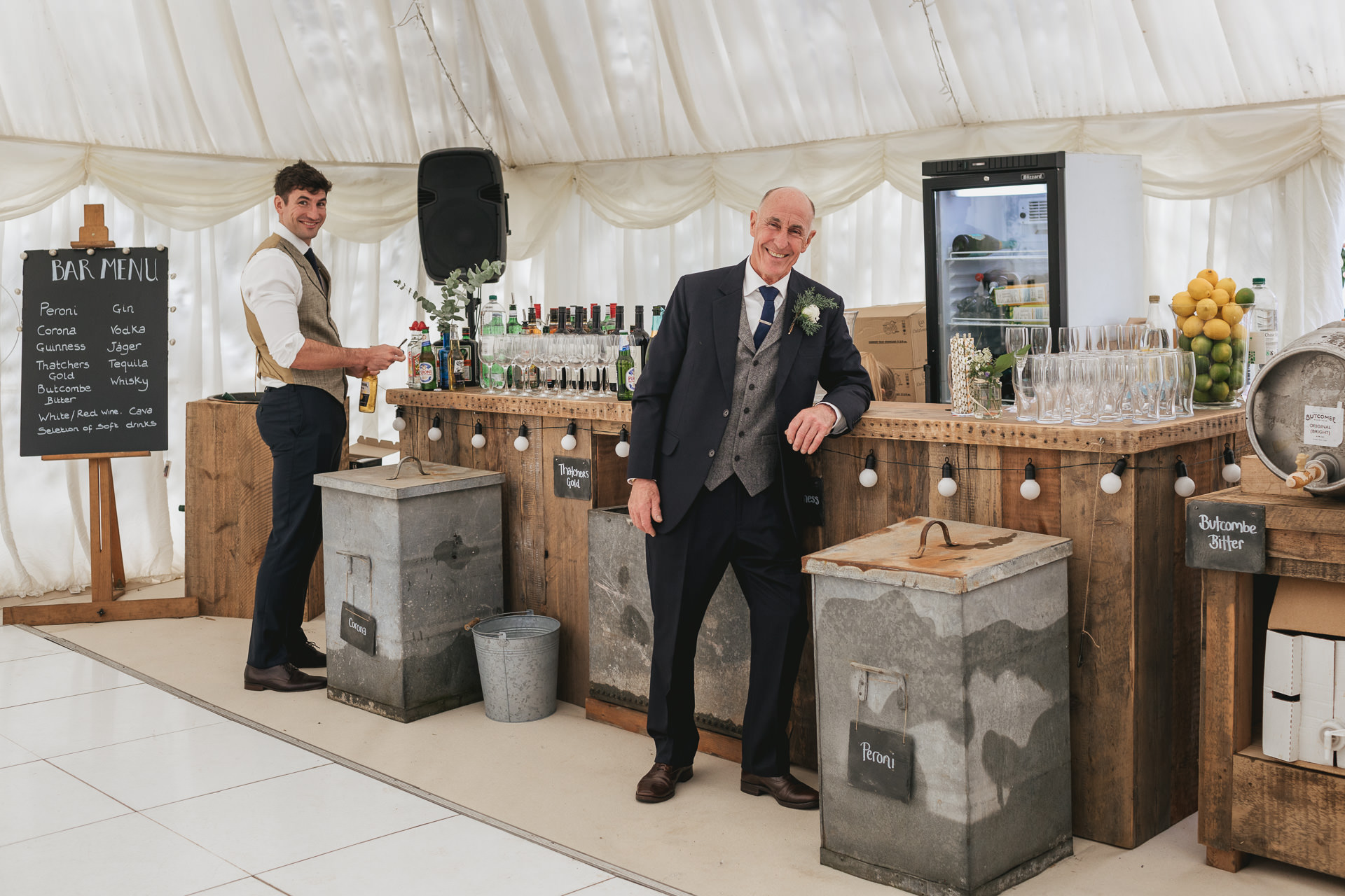 Father of the bride and groom, standing by homemade wedding bar