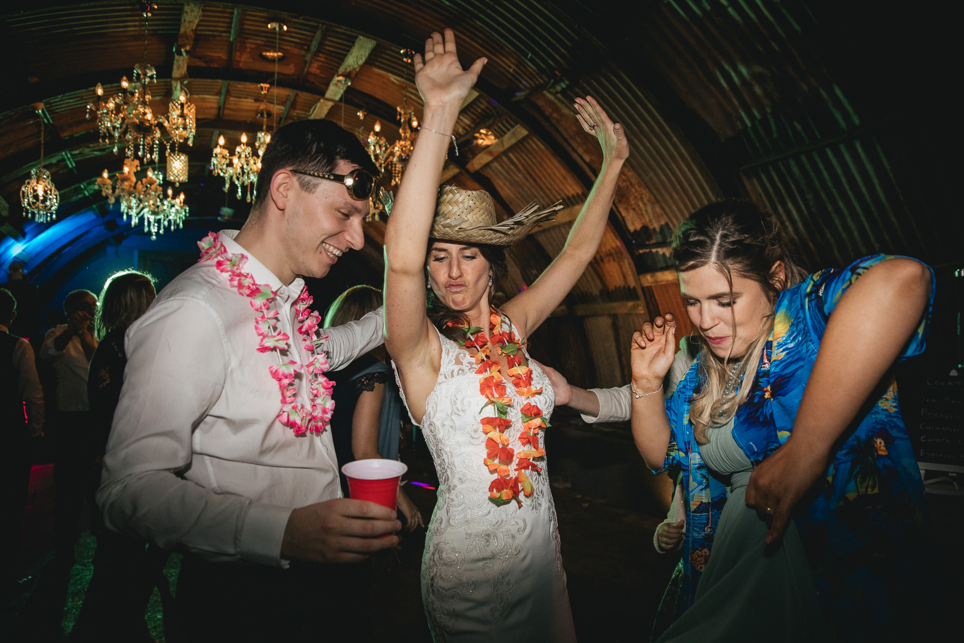 Bride and wedding guests dancing