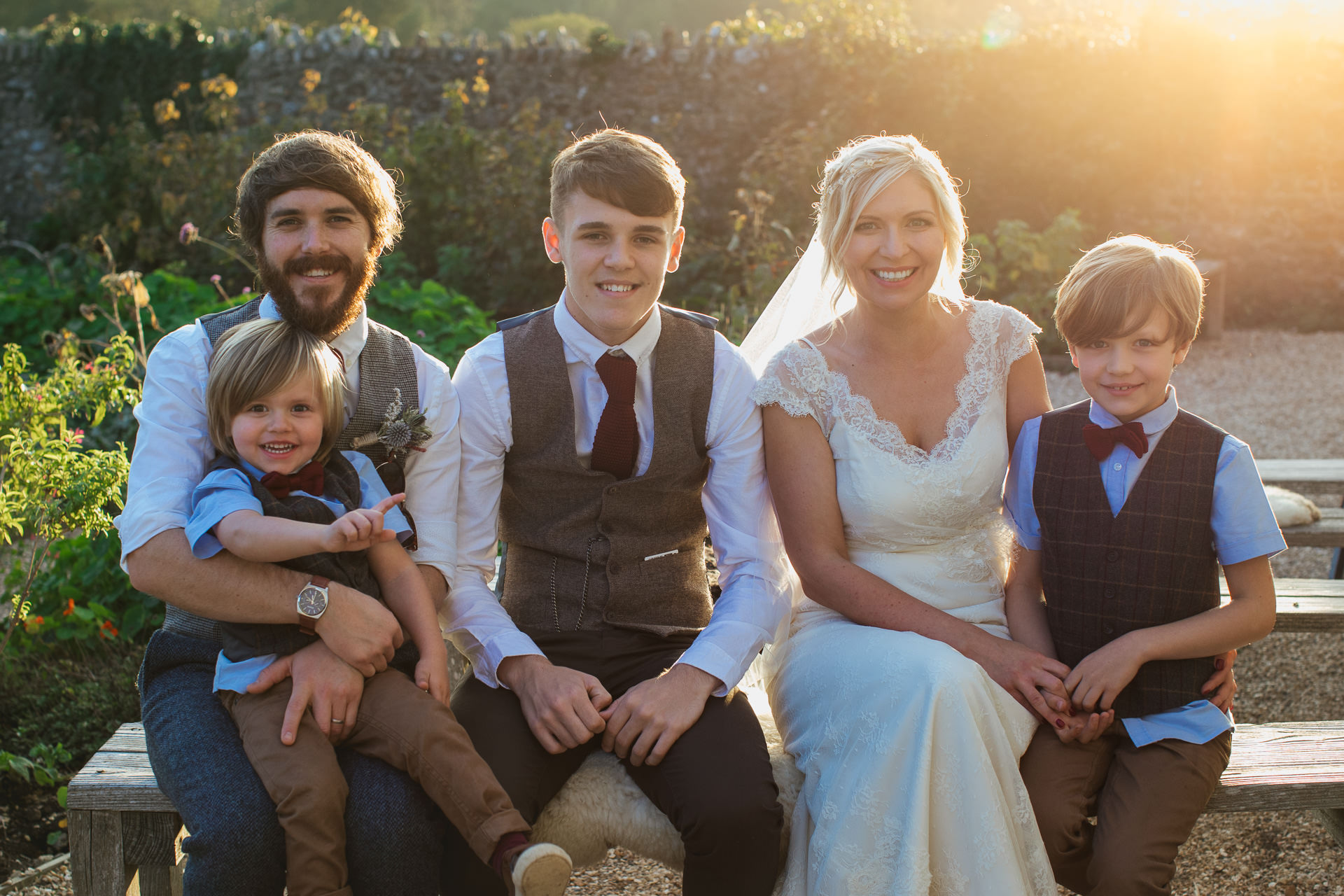Bride and groom with family in the kitchen garden at River Cottage