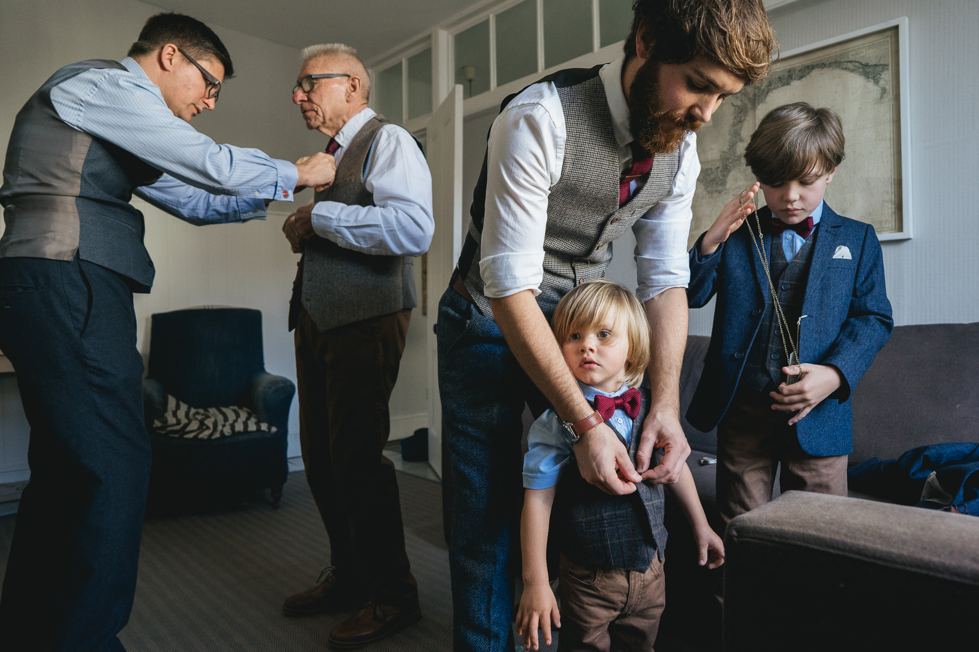 Group of men and boys getting ready for a wedding