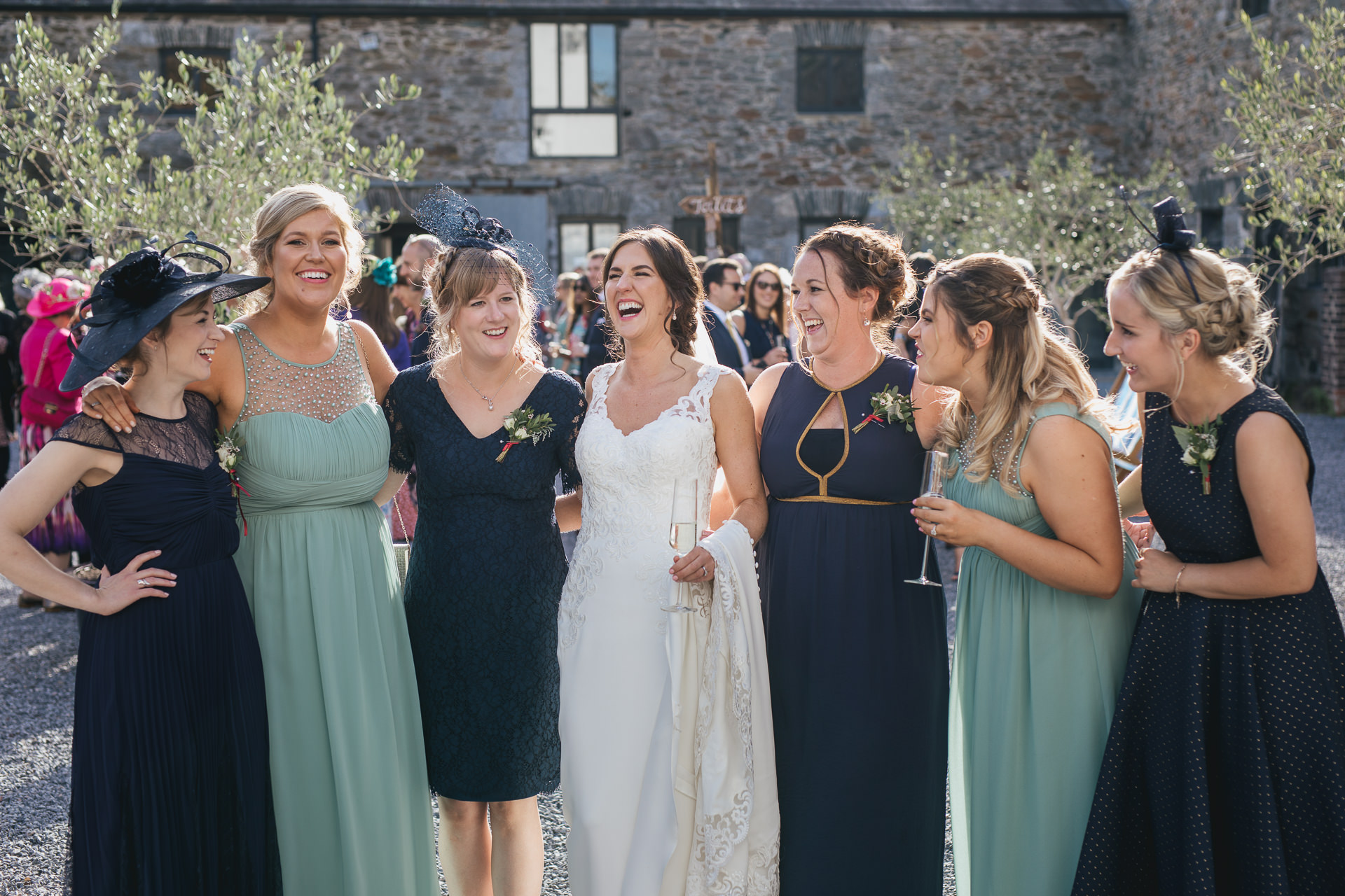 Bride with group of friends laughing together