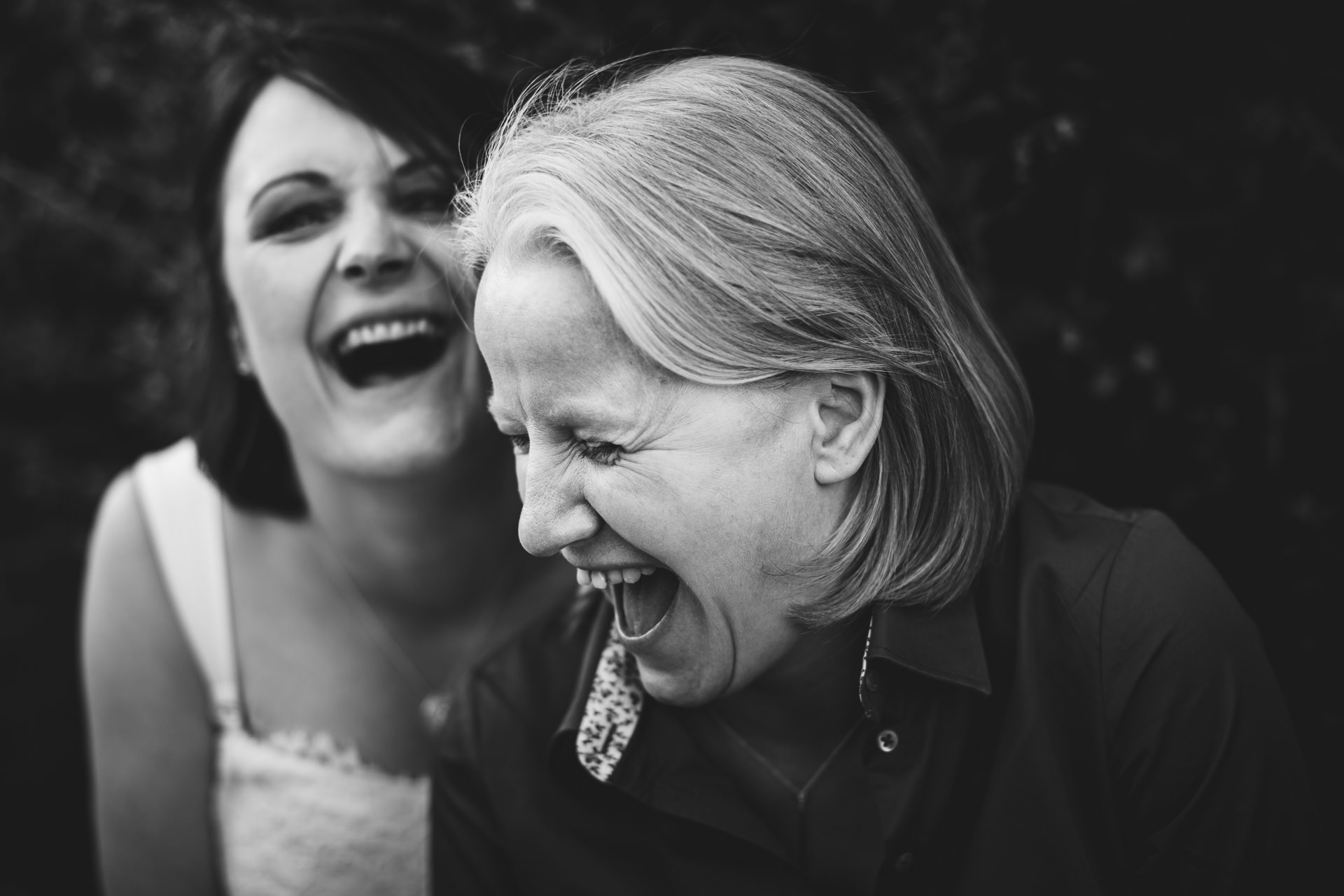 Bride and bride laughing together