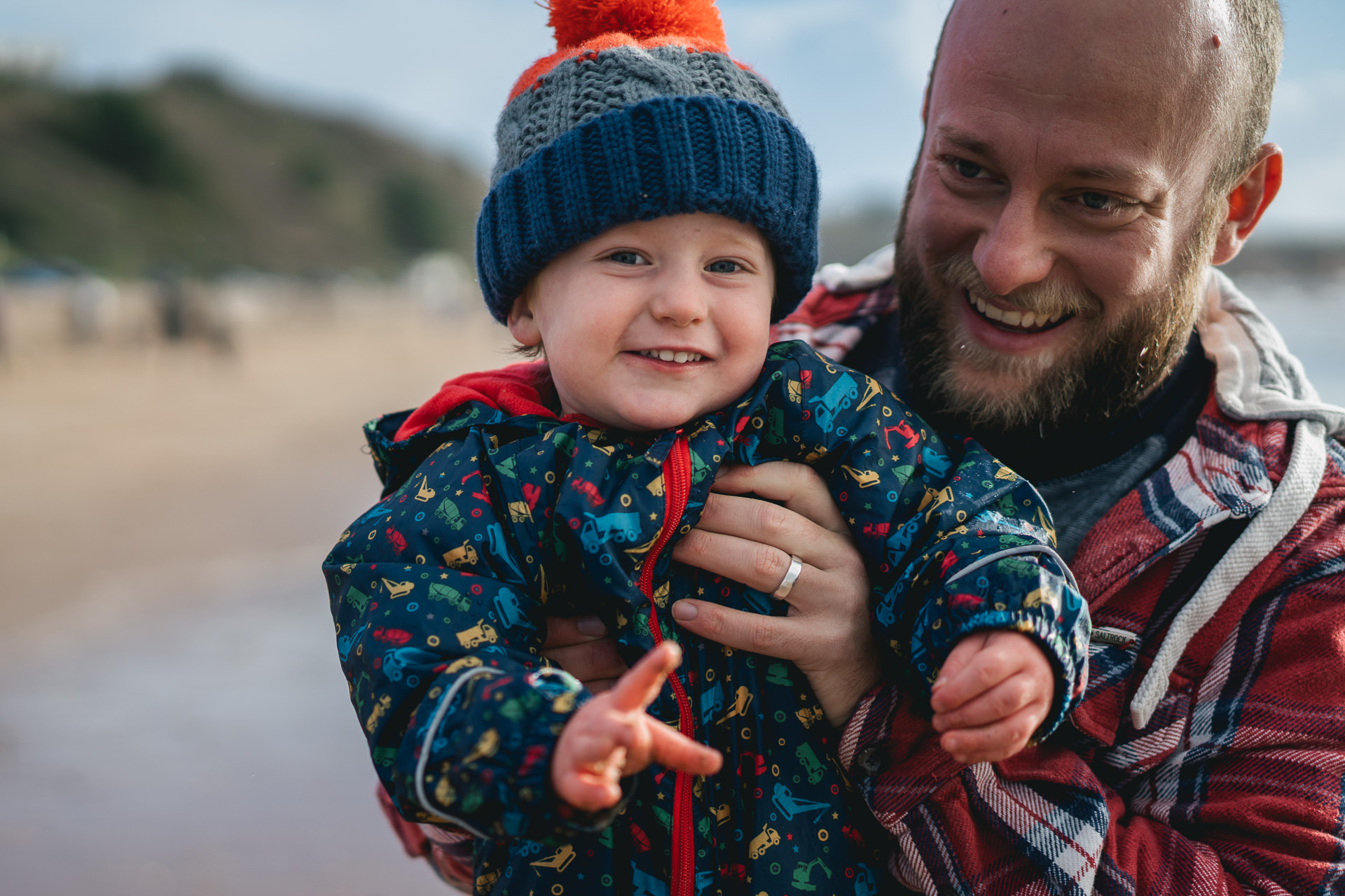 Exmouth family photography, a father holding his toddler son