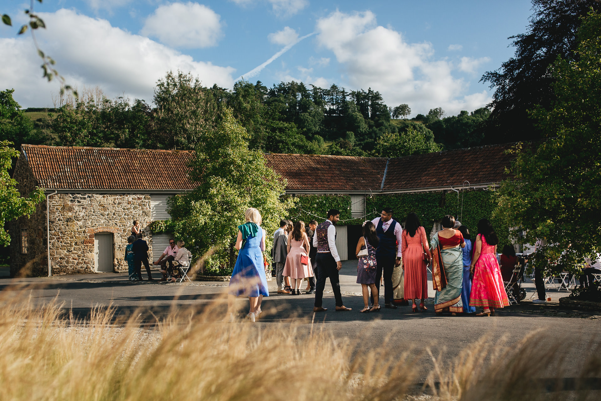 Wedding guests outside the great barn