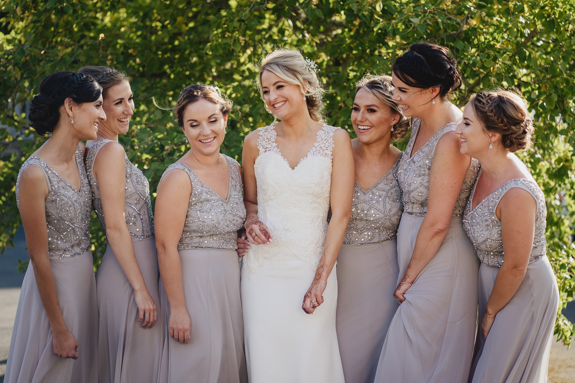 BRide and bridesmaids laughing together