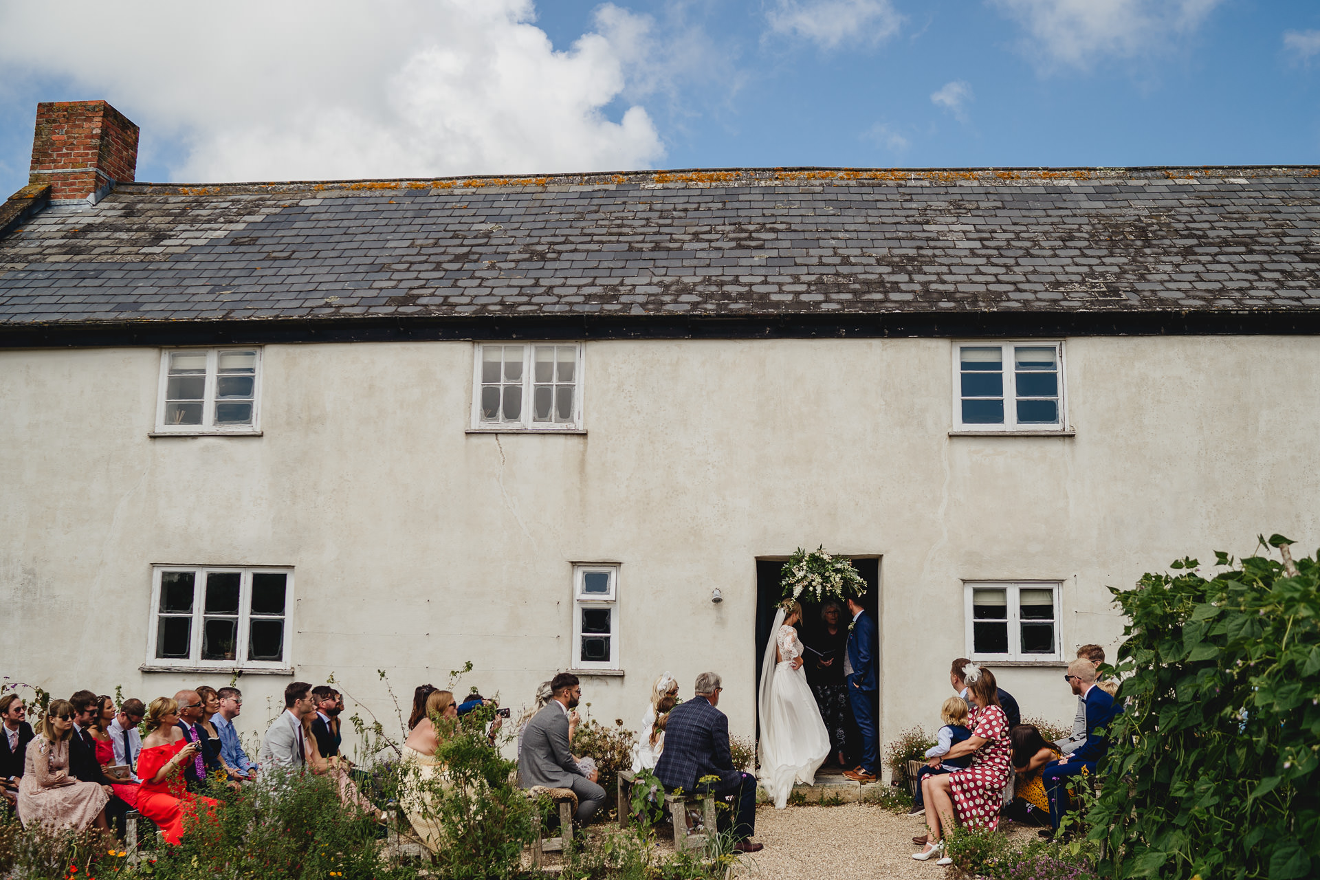 A wedding ceremony outside River Cottage