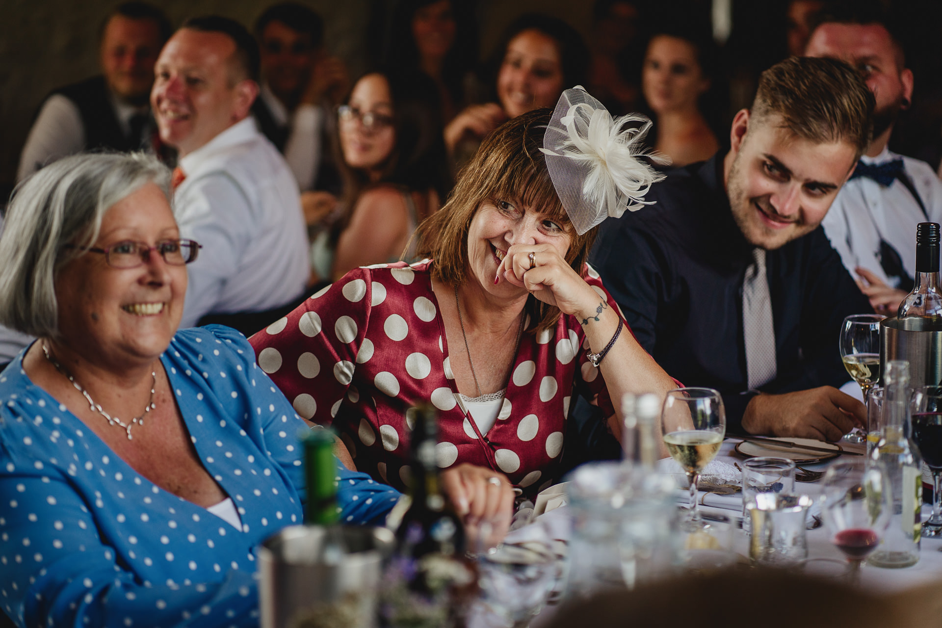 Guests laughing at wedding speeches at River Cottage