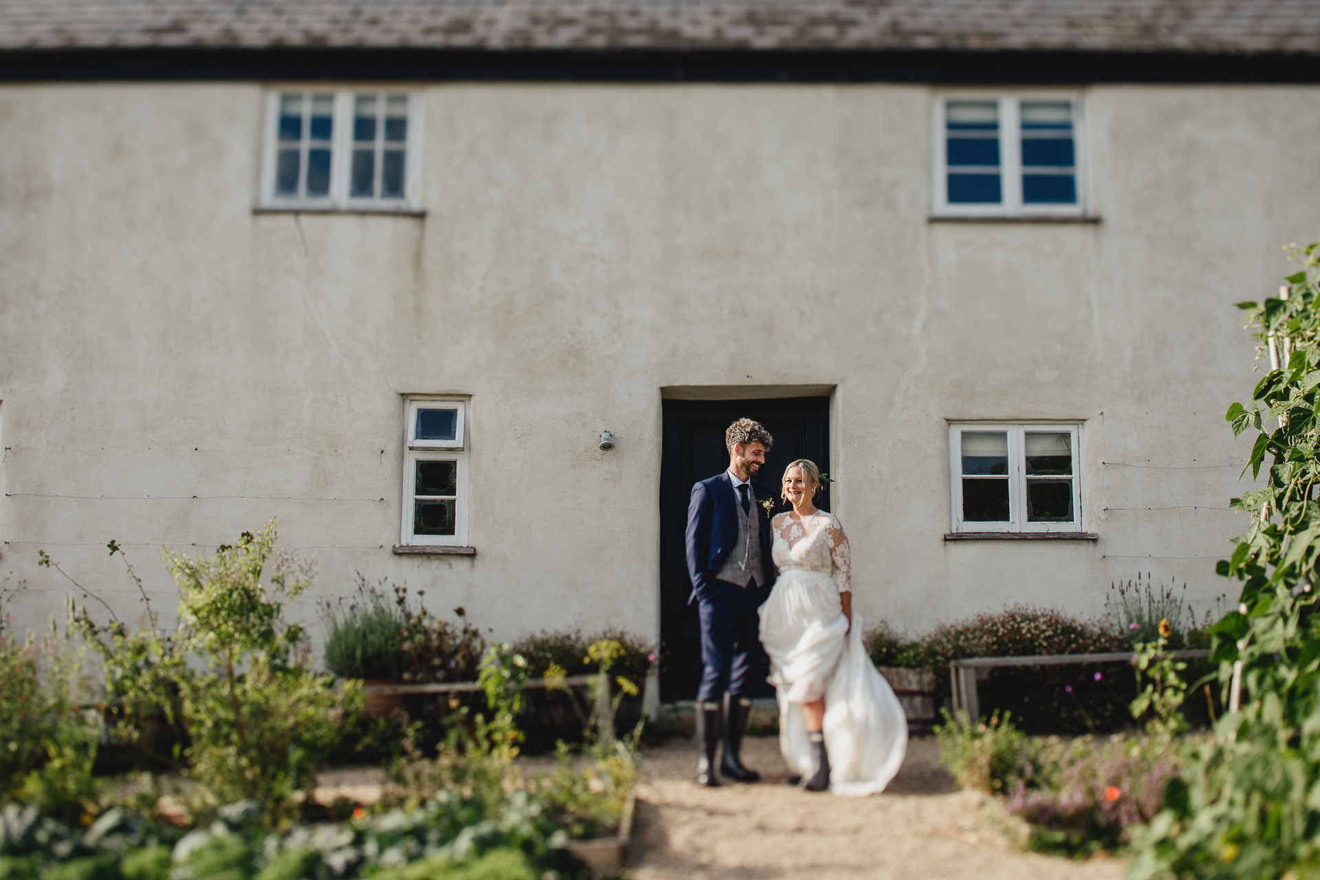 A just married couple outside River Cottage farmhouse