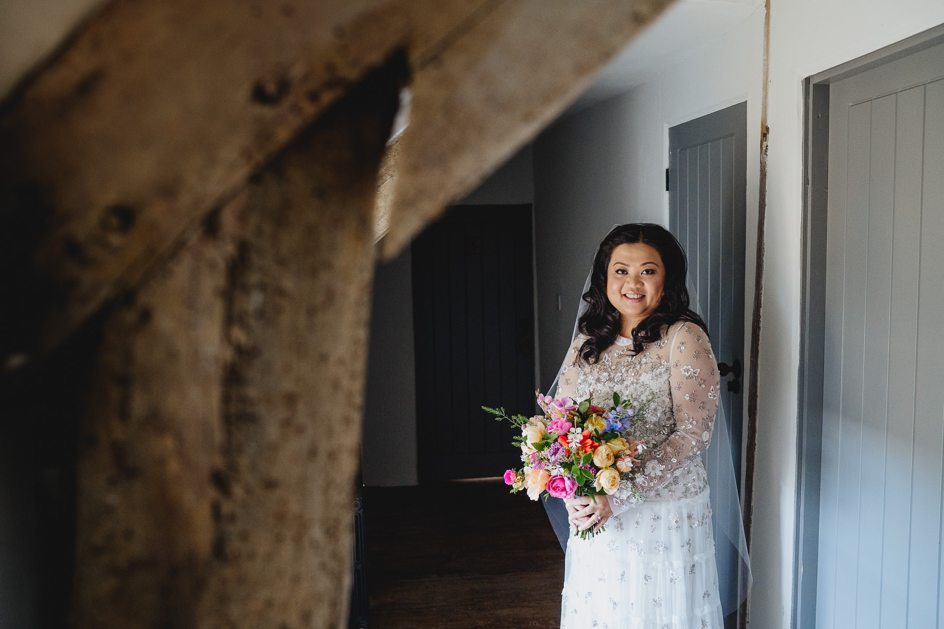 a bride with a colourful bouquet of flowers