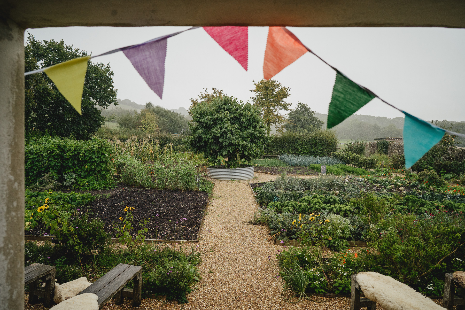 Heavy rain during an autumn wedding in the kitchen garden