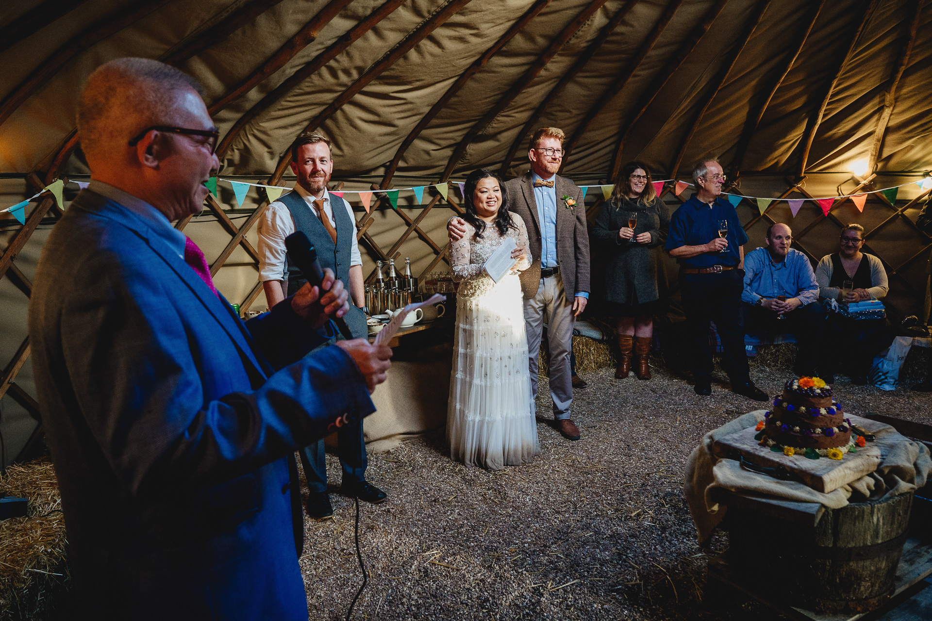 wedding guests during speeches in a yurt