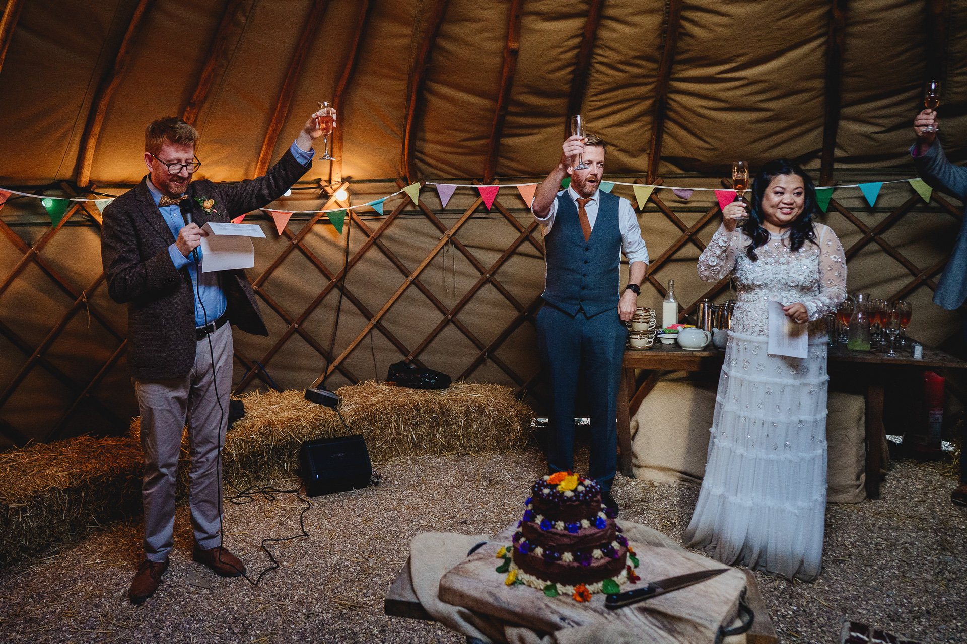 wedding guests during speeches in a yurt