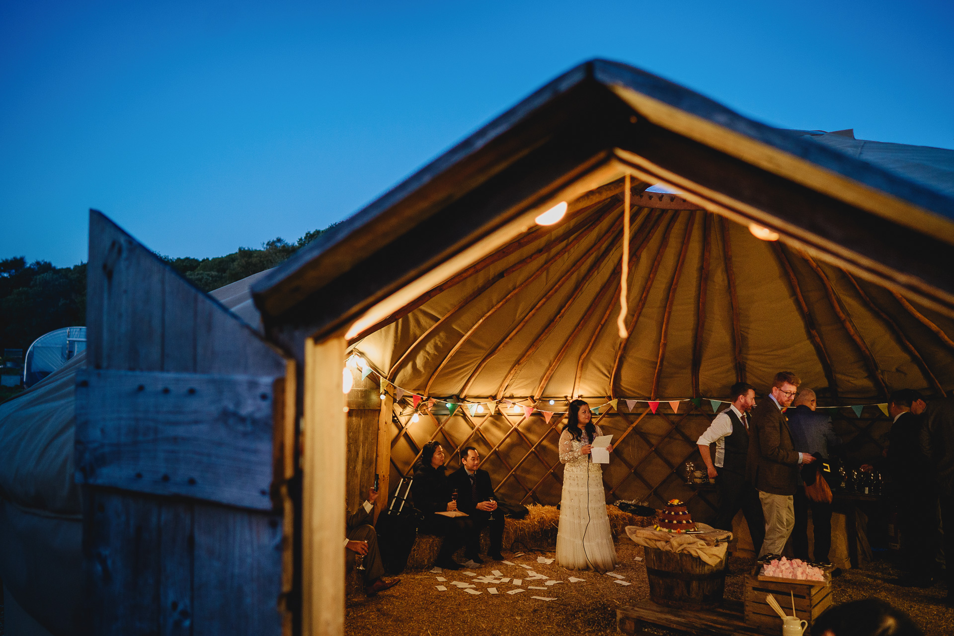 bride giving wedding speech in a yurt