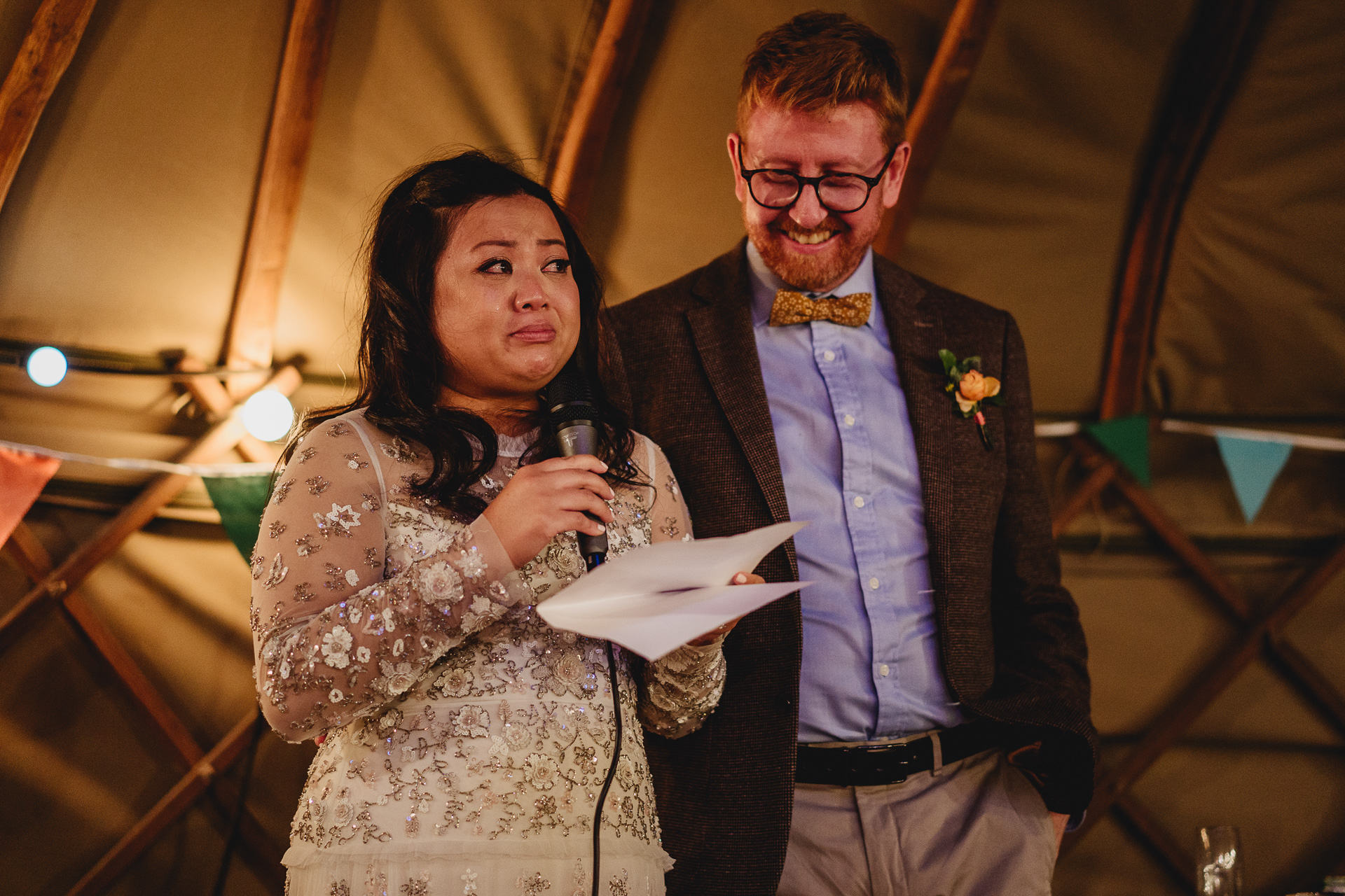 bride giving wedding speech in a yurt