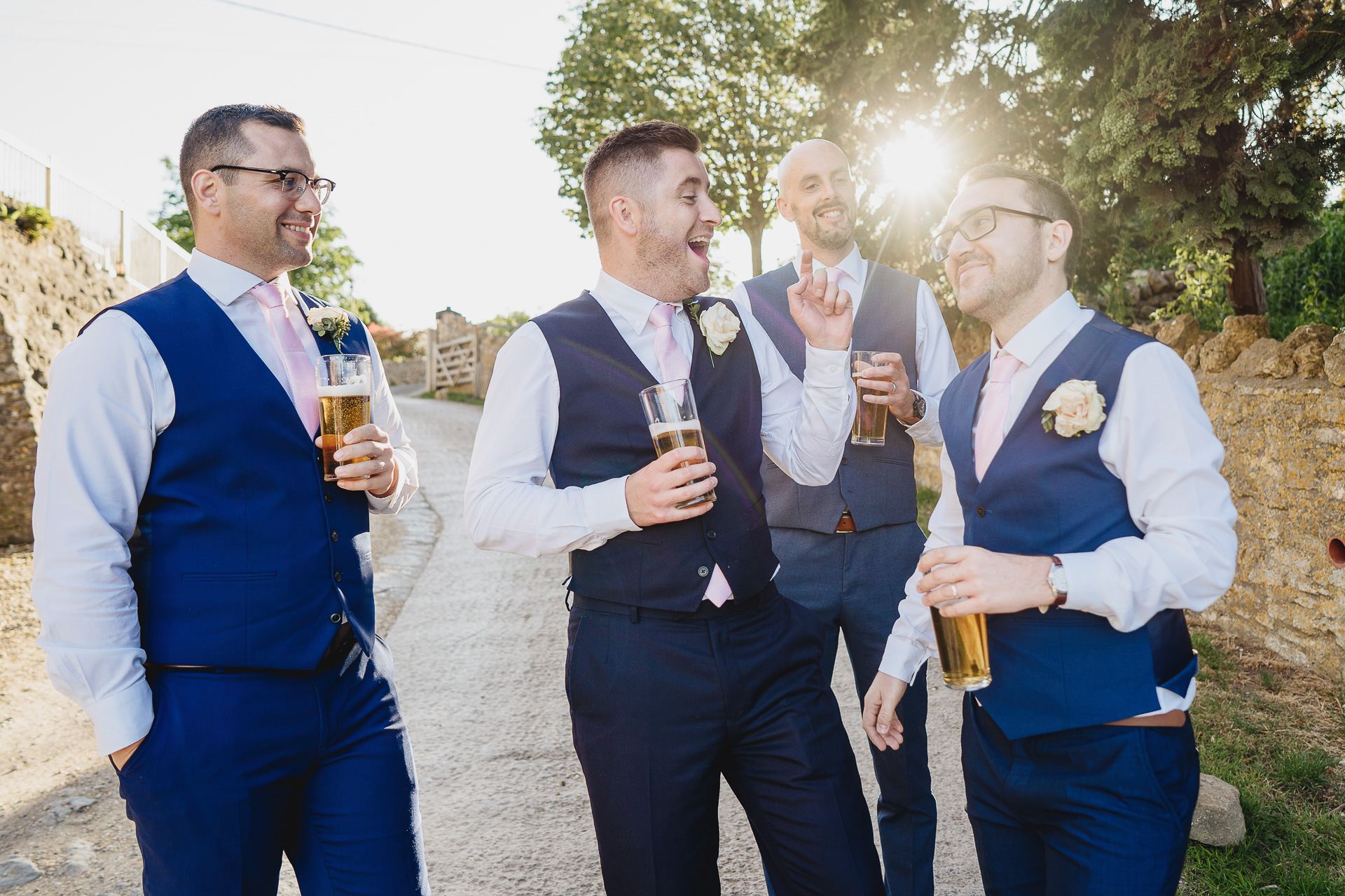 Group of groomsmen laughing together