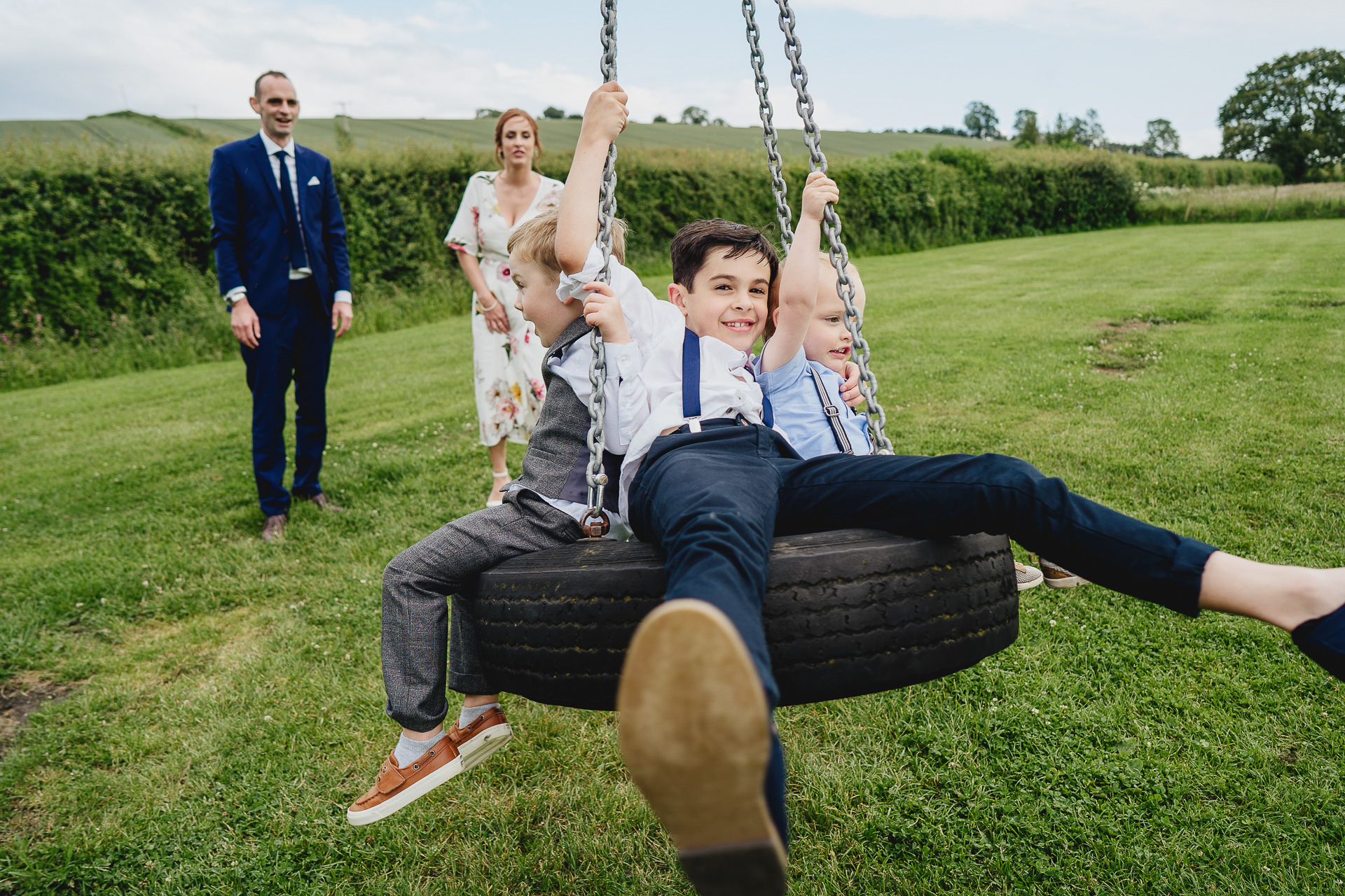 Children on a tyre swing together