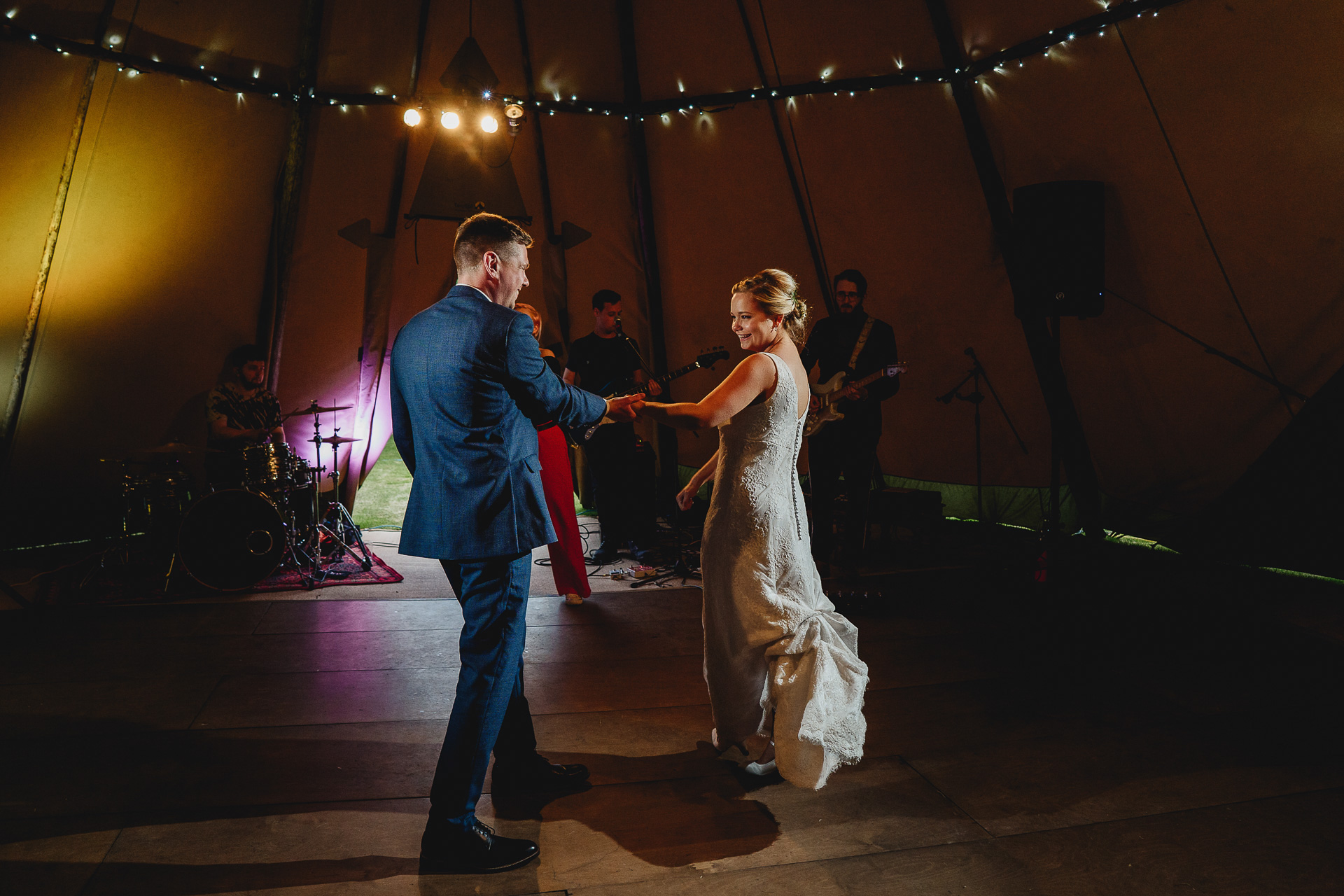 Bride and groom doing first dance in a tipi