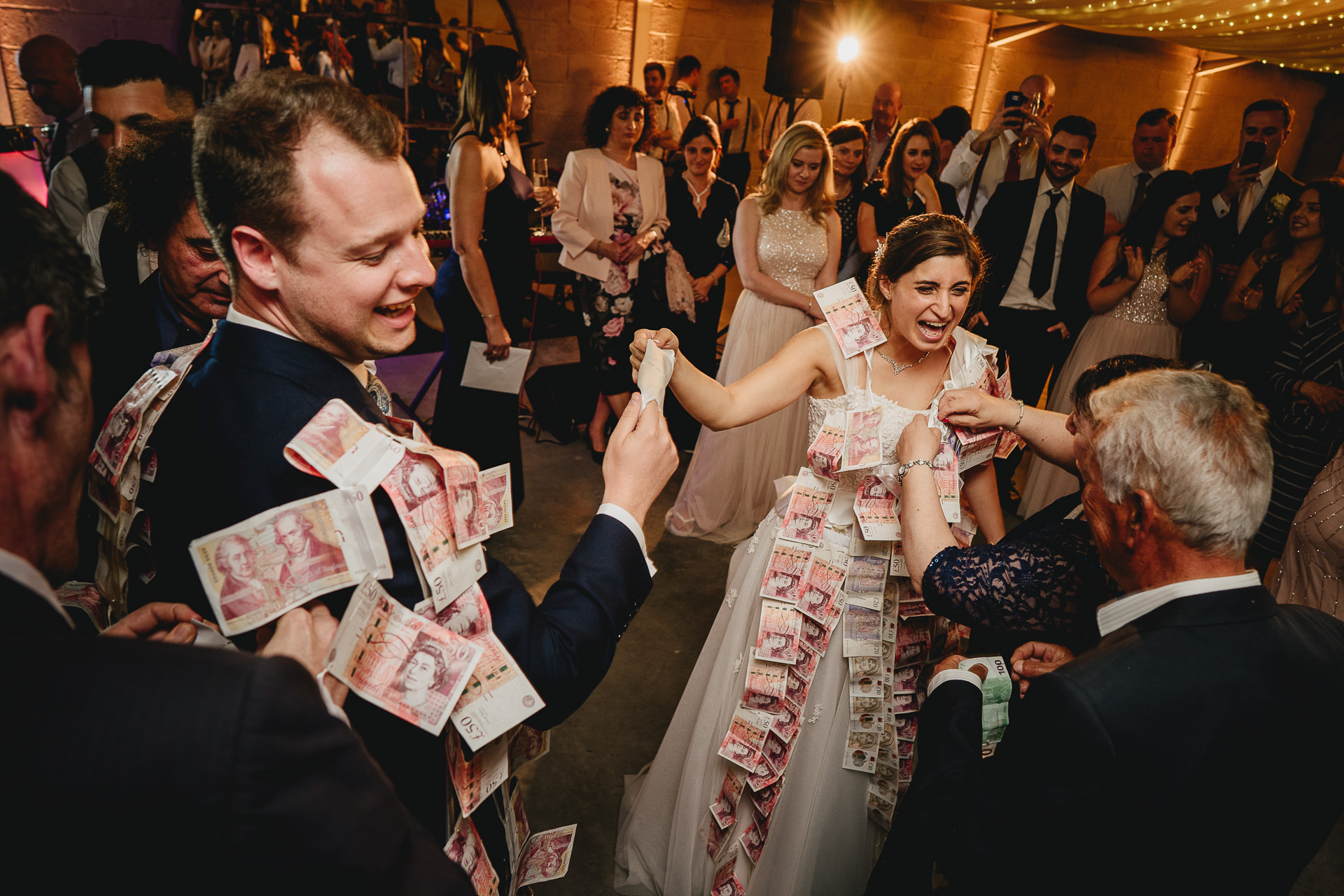 Bride and groom during traditional Greek money dance
