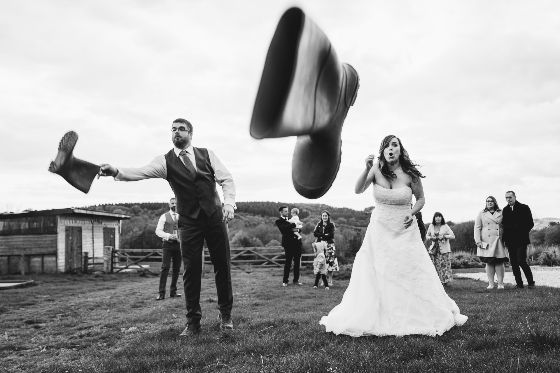 Bride throwing a wellington boot towards the camera