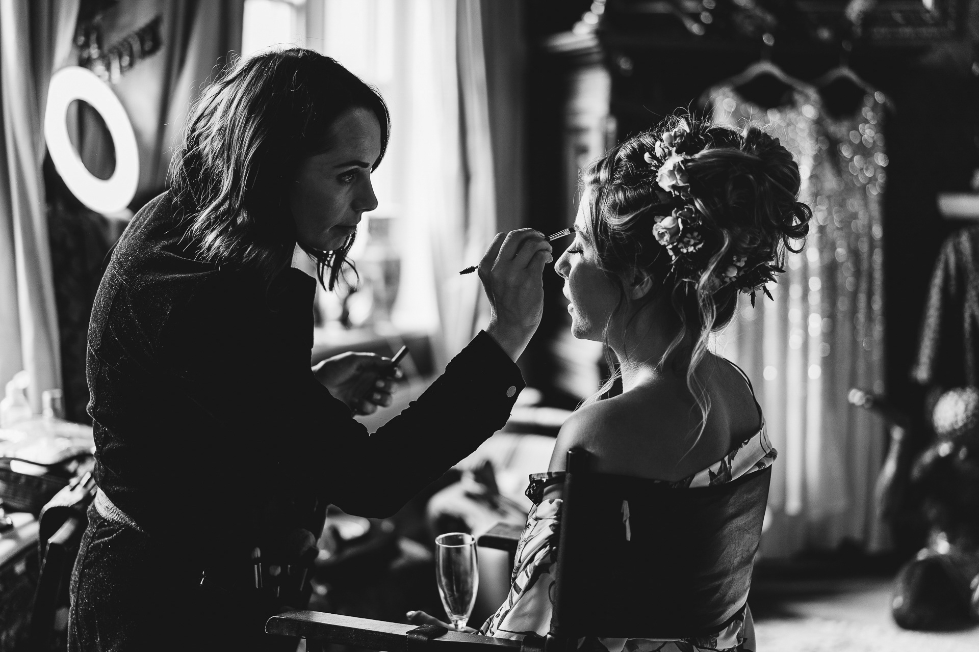 A woman having her make up applied