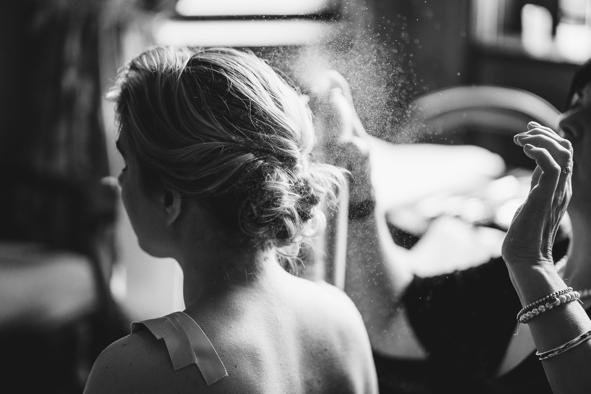 A bride to be having her hair sprayed