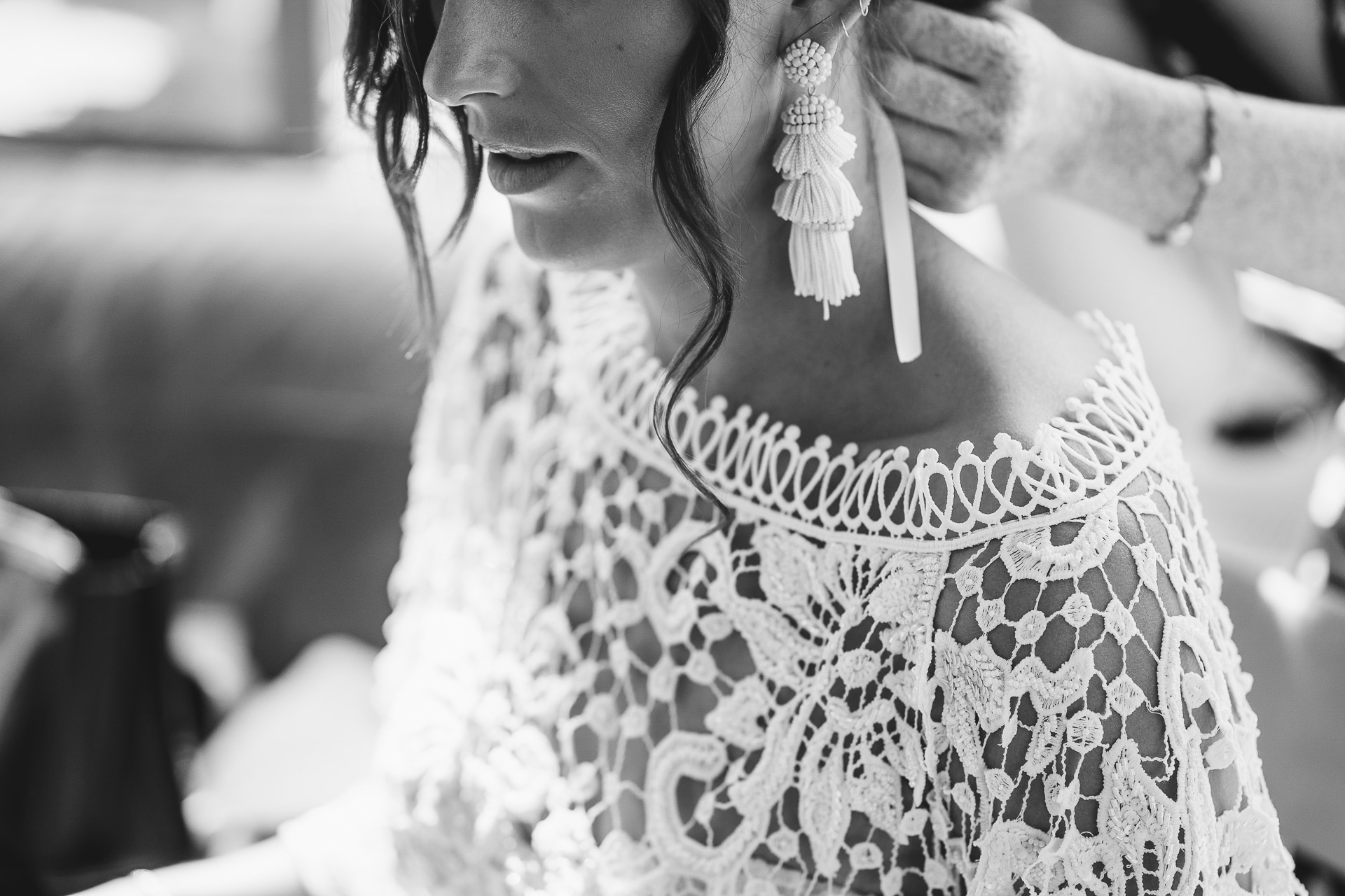 Close up of bride with large tassle earrings