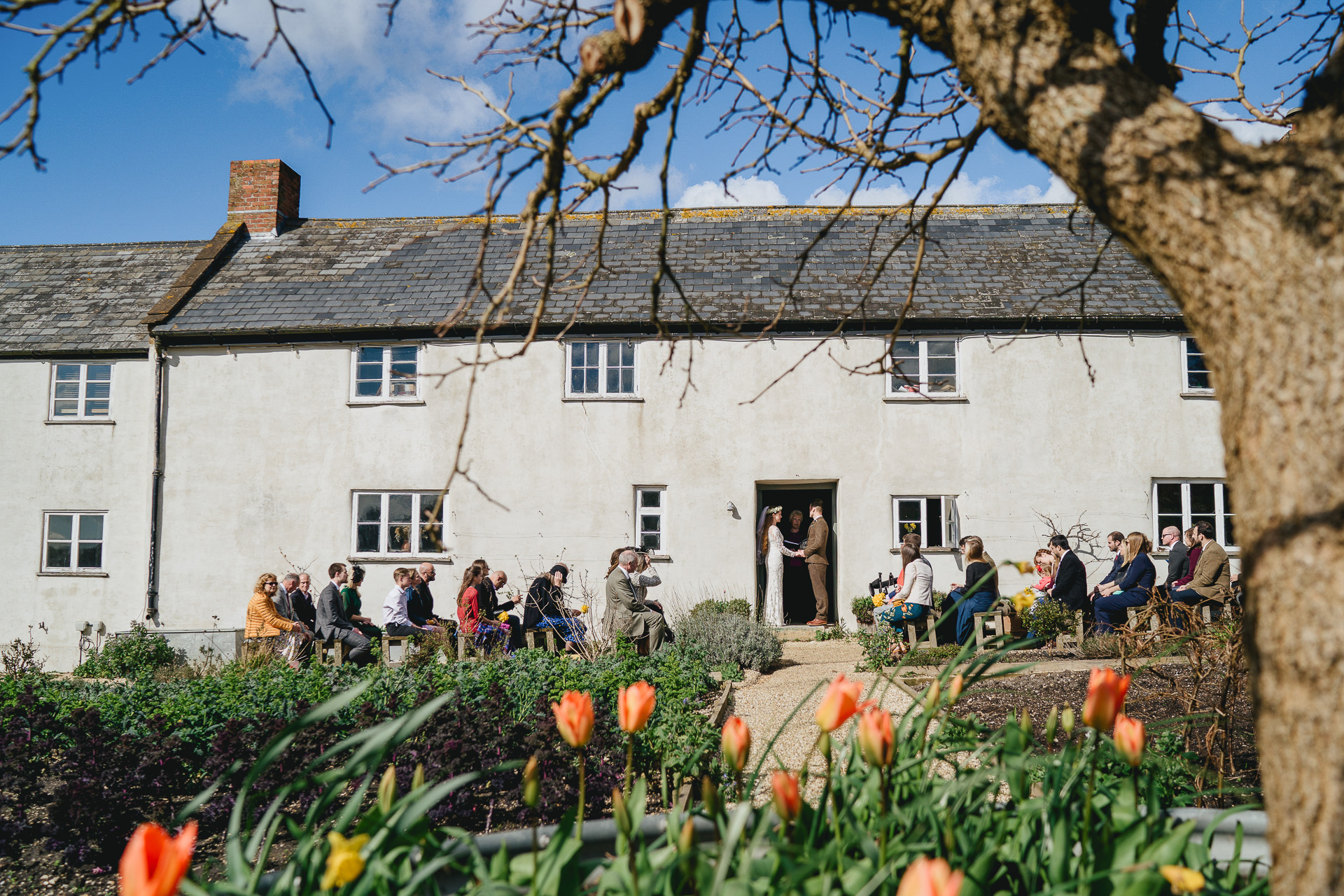 Outdoor wedding ceremony at River Cottage farmhouse
